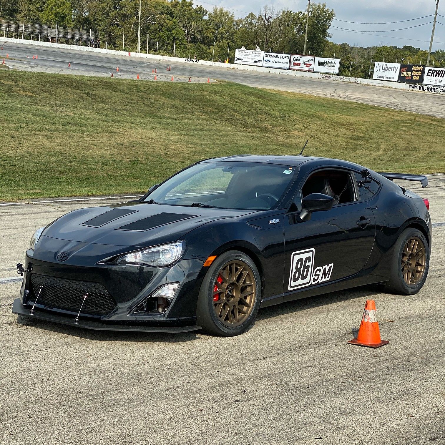 Black Scion FR-S with 17" ARC-8 Apex wheels in Satin Bronze