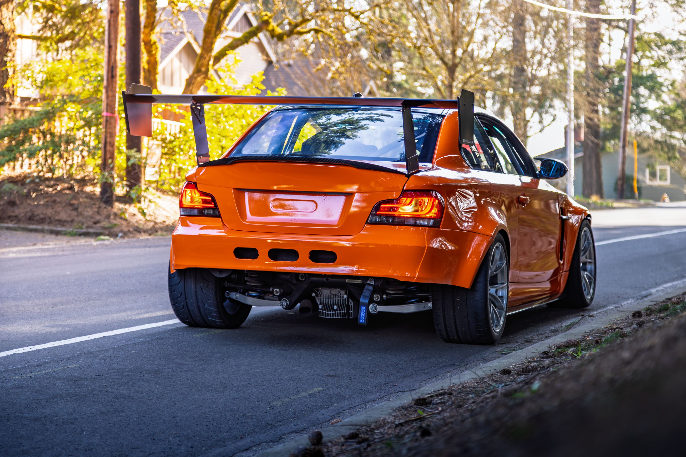 Orange BMW E82 1M with 18" VS-5RS Apex wheels in Brushed Clear