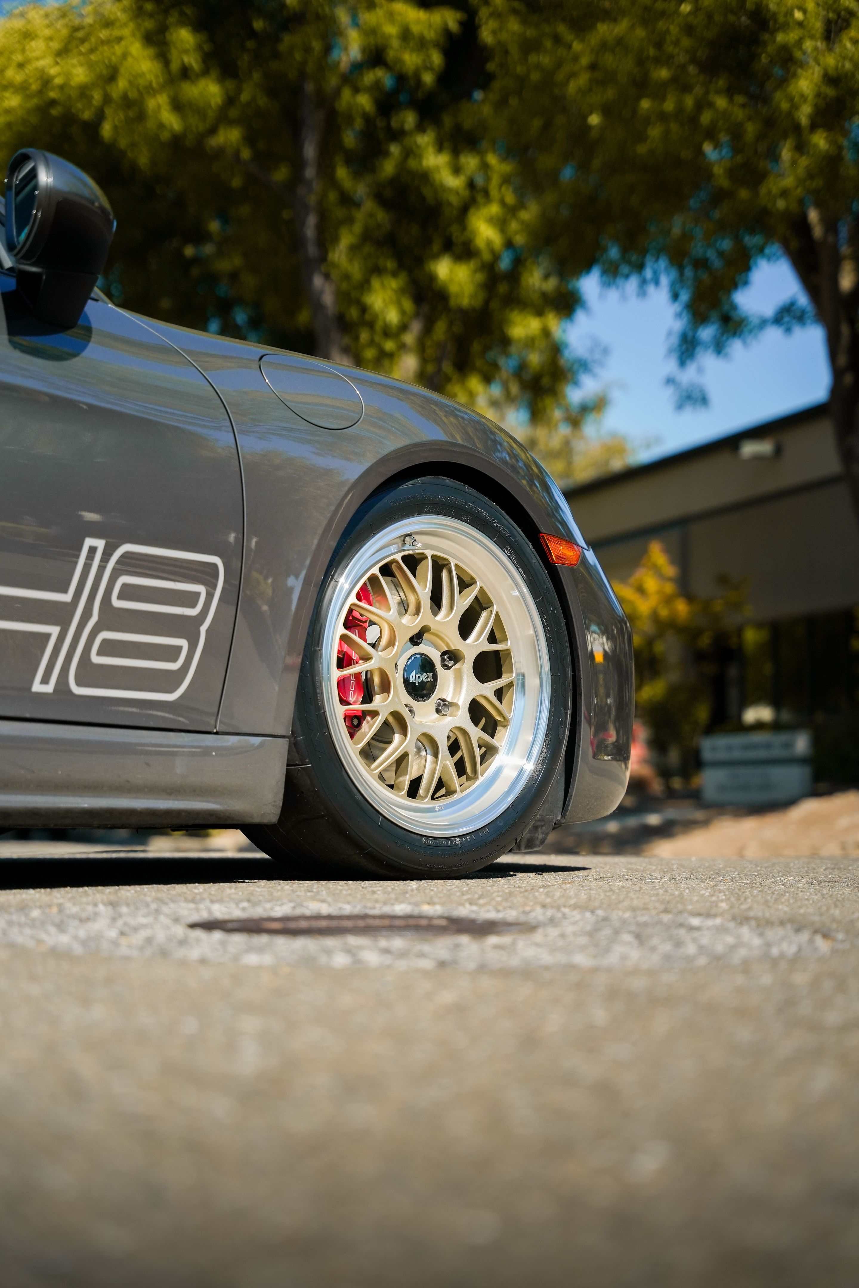 Grey Porsche 718 Cayman S with 18" ML-10RT Apex wheels in Machined Lip Gloss Motorsport Gold