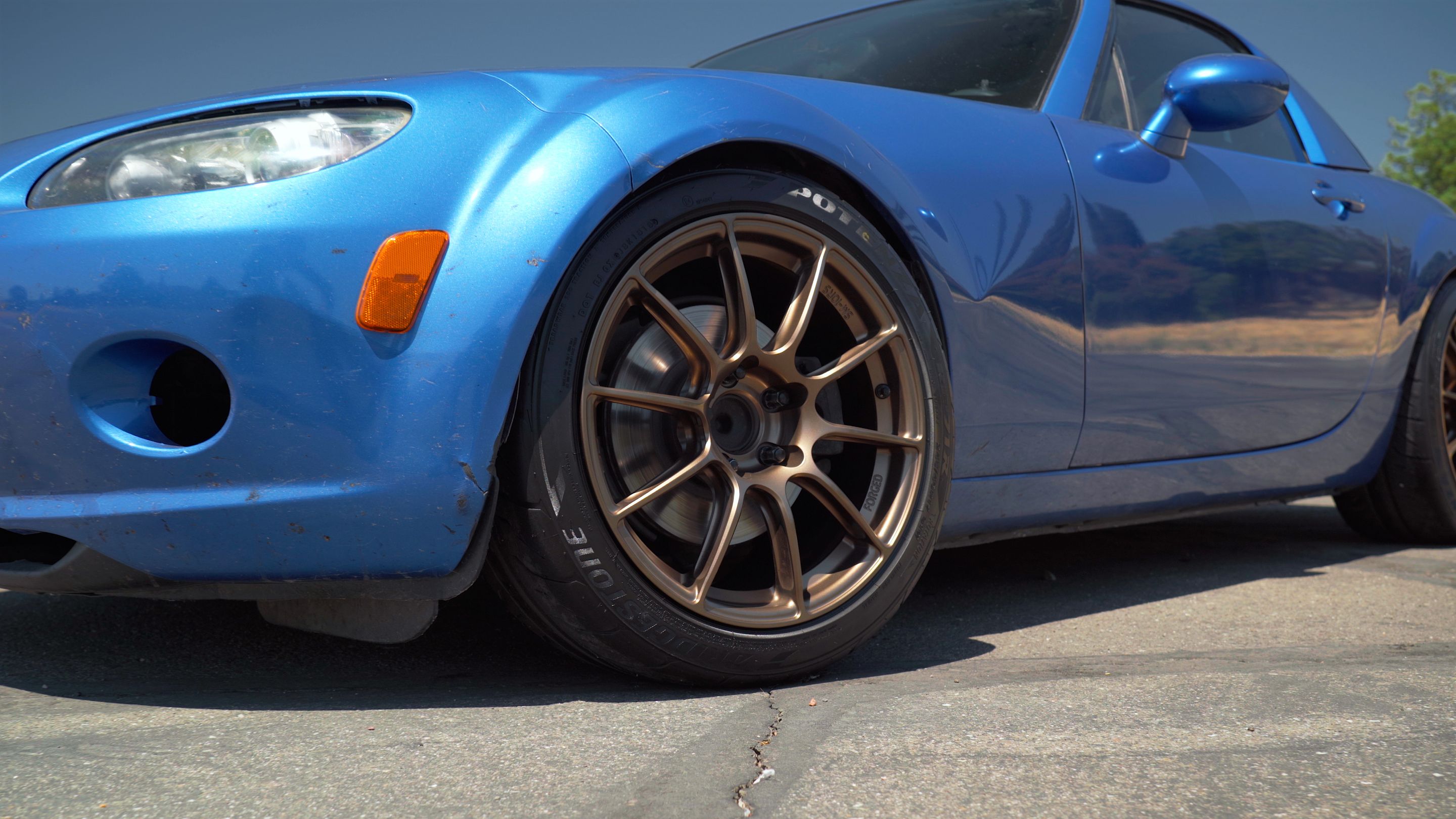 Blue Mazda NC MX-5 Miata with 17" SM-10RS Apex wheels in Satin Bronze