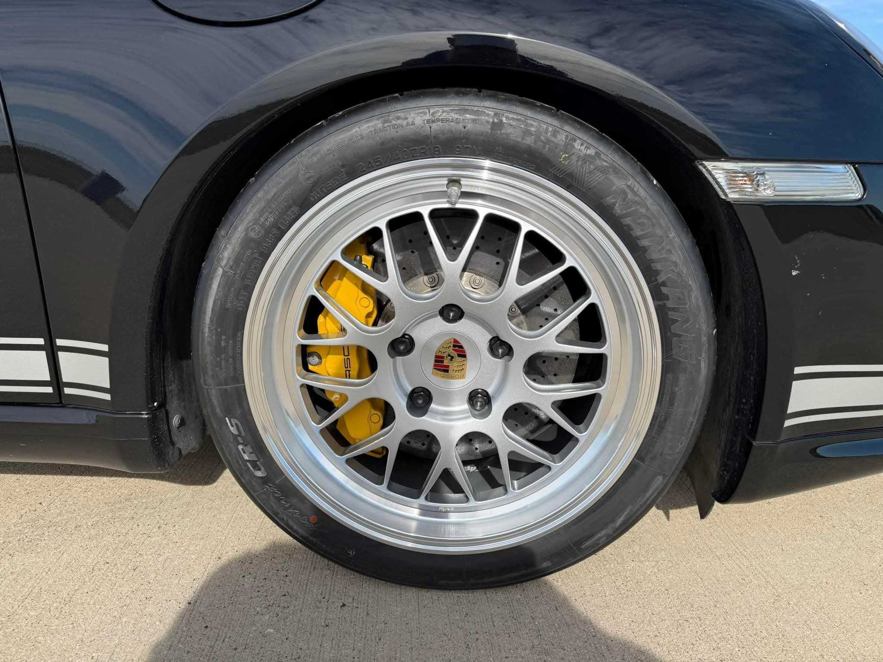 Black Porsche 987 Cayman R with 18" ML-10RT Apex wheels in Machined Lip Race Silver