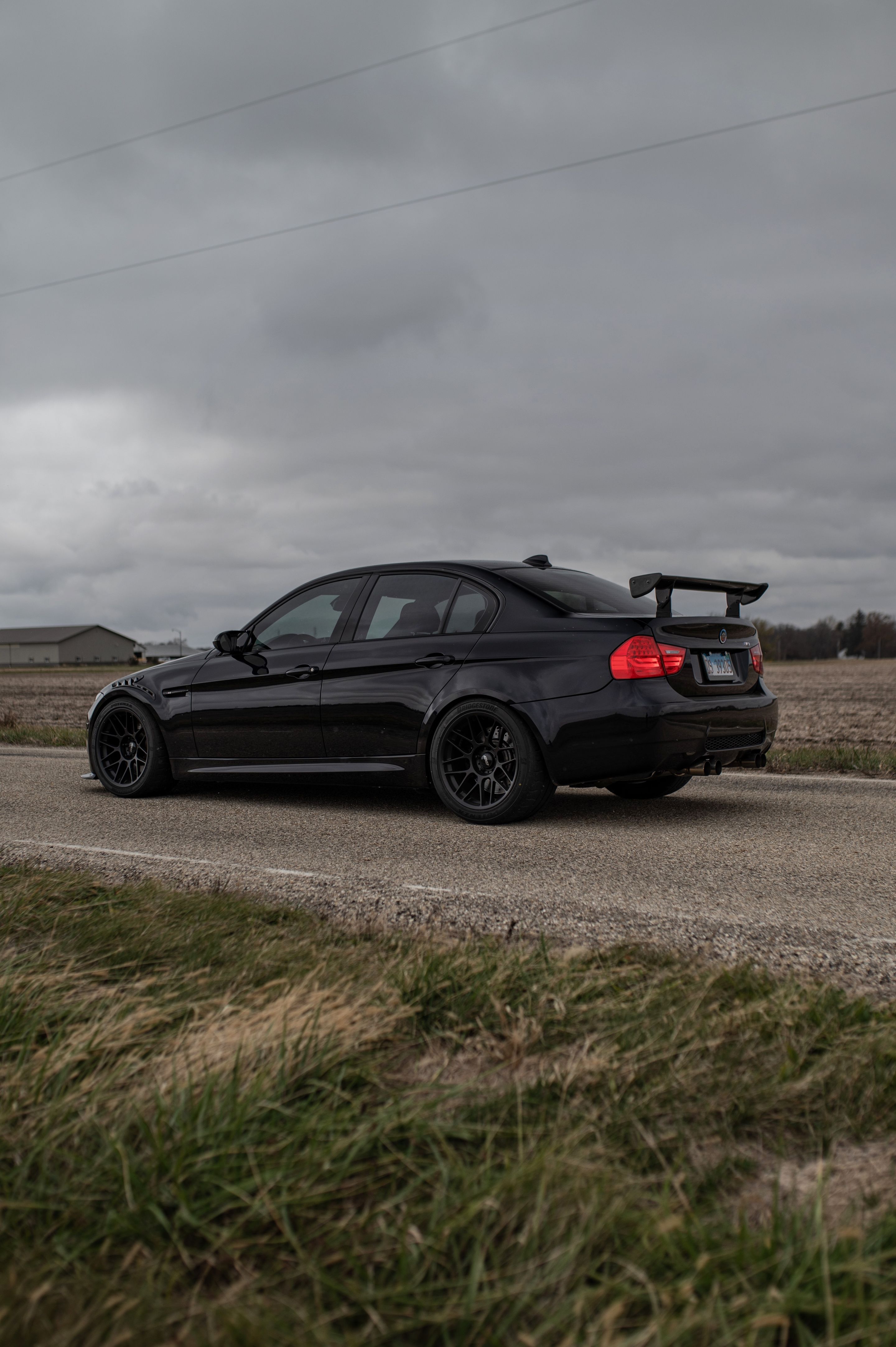 Black BMW E90 Sedan M3 with 18" ARC-8 Apex wheels in Satin Black