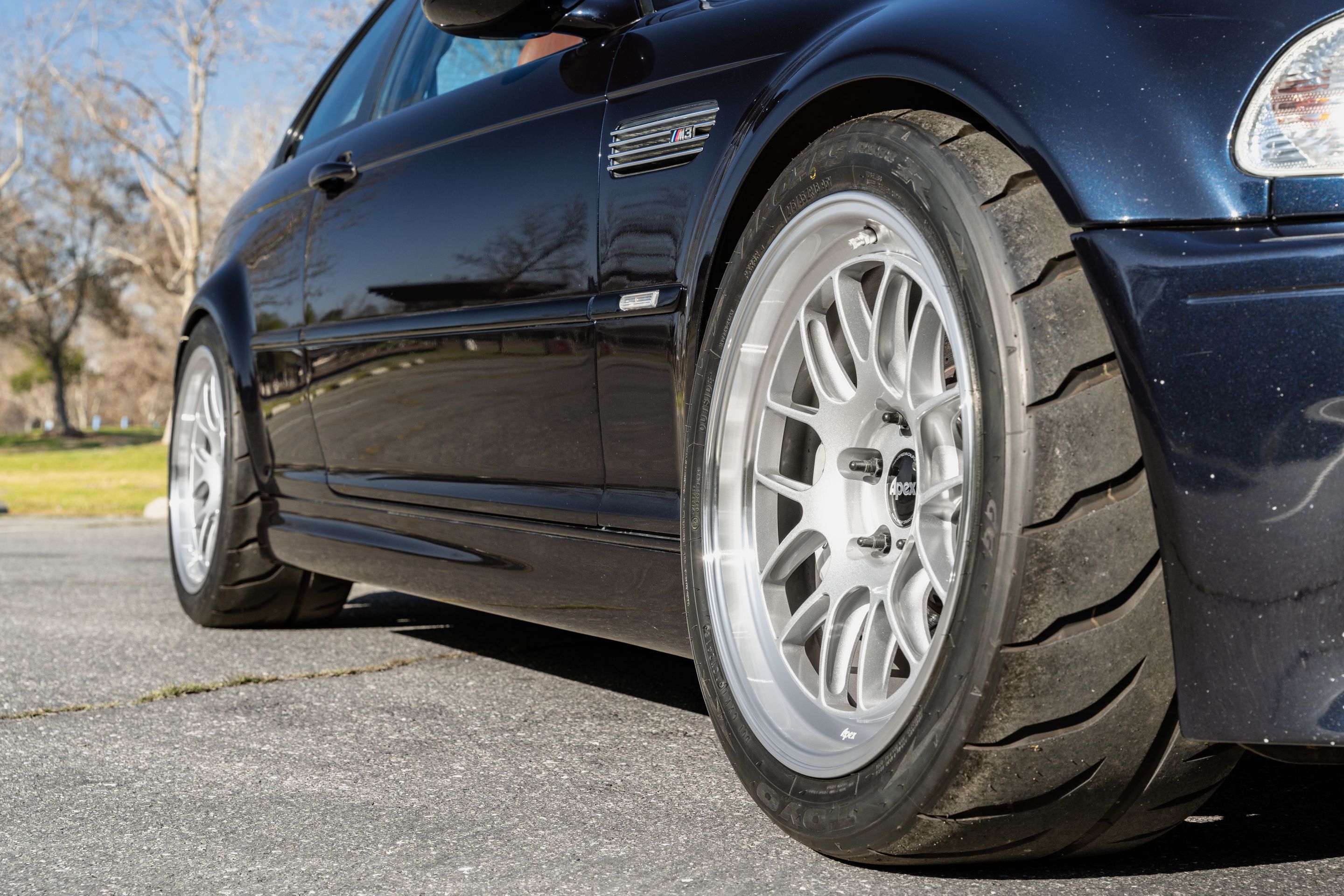 Black BMW E46 M3 with 18" ML-7RT Apex wheels in Machined Lip Race Silver