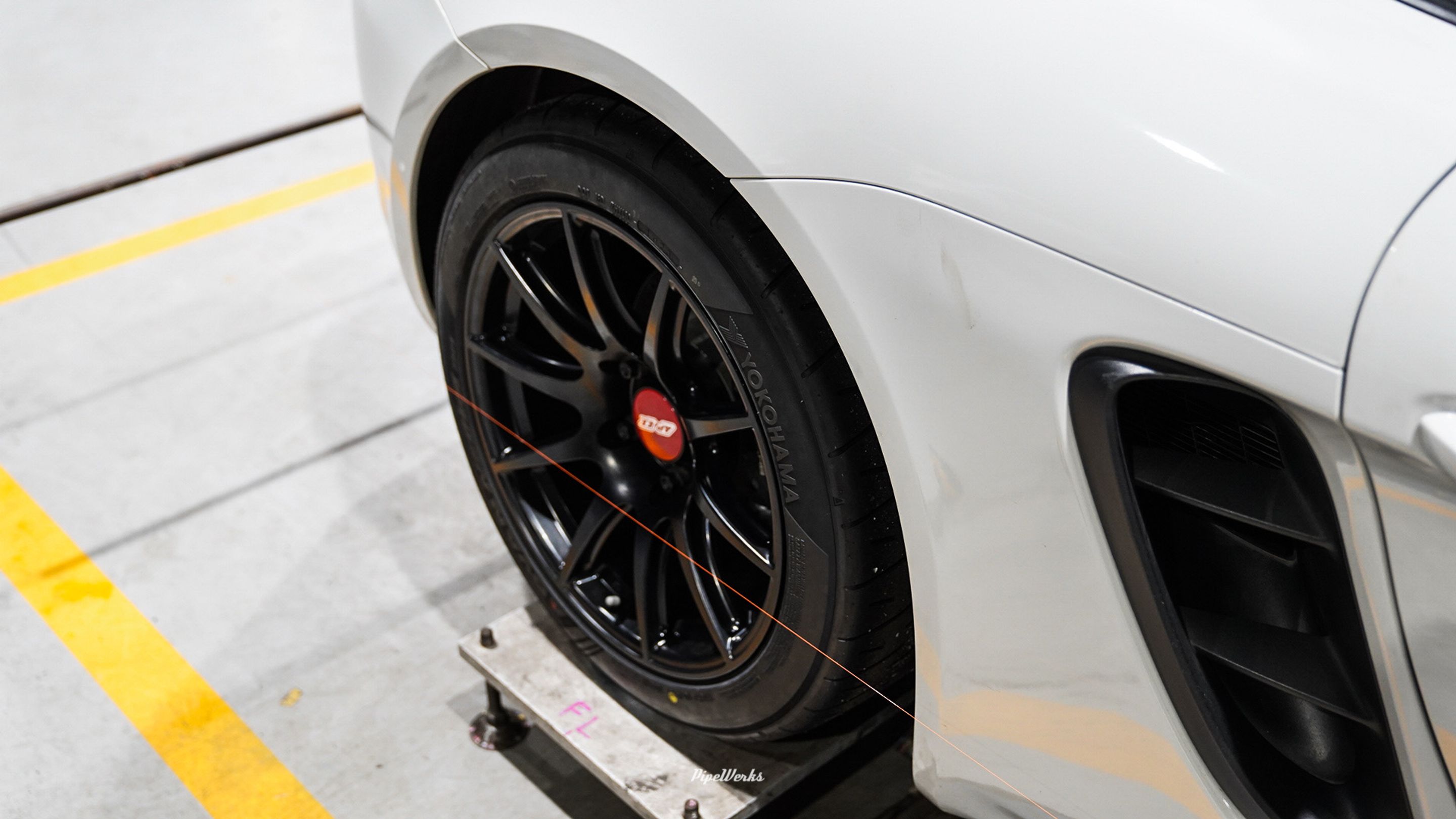 White Porsche 718 Cayman Base with 18" SM-10 Apex wheels in Satin Black