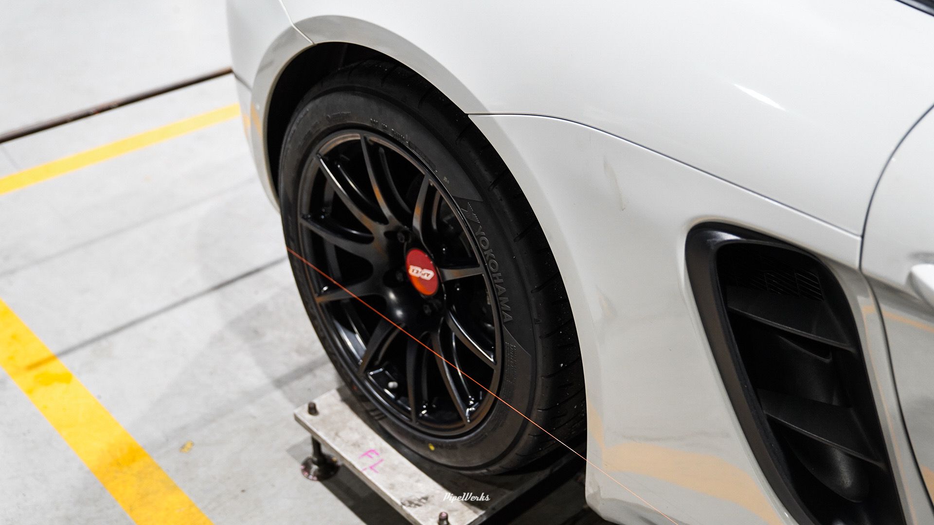 White Porsche 718 Cayman Base with 18" SM-10 Apex wheels in Satin Black