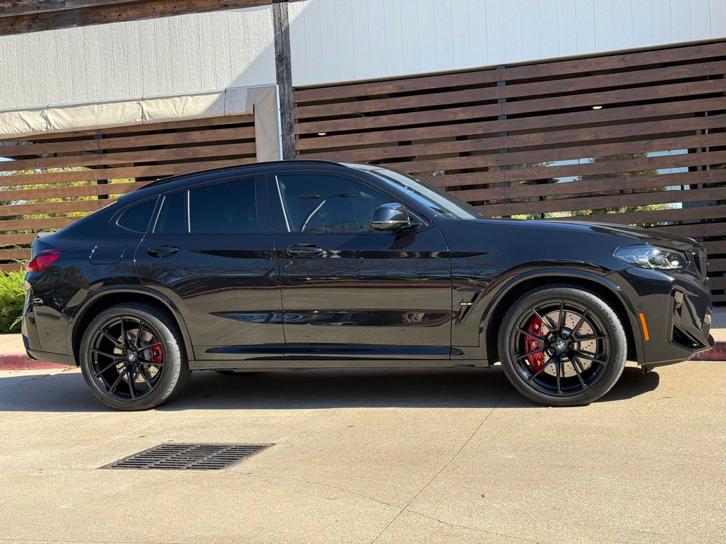 Black BMW F98 X4M with 21" VS-5RX Apex wheels in Satin Black
