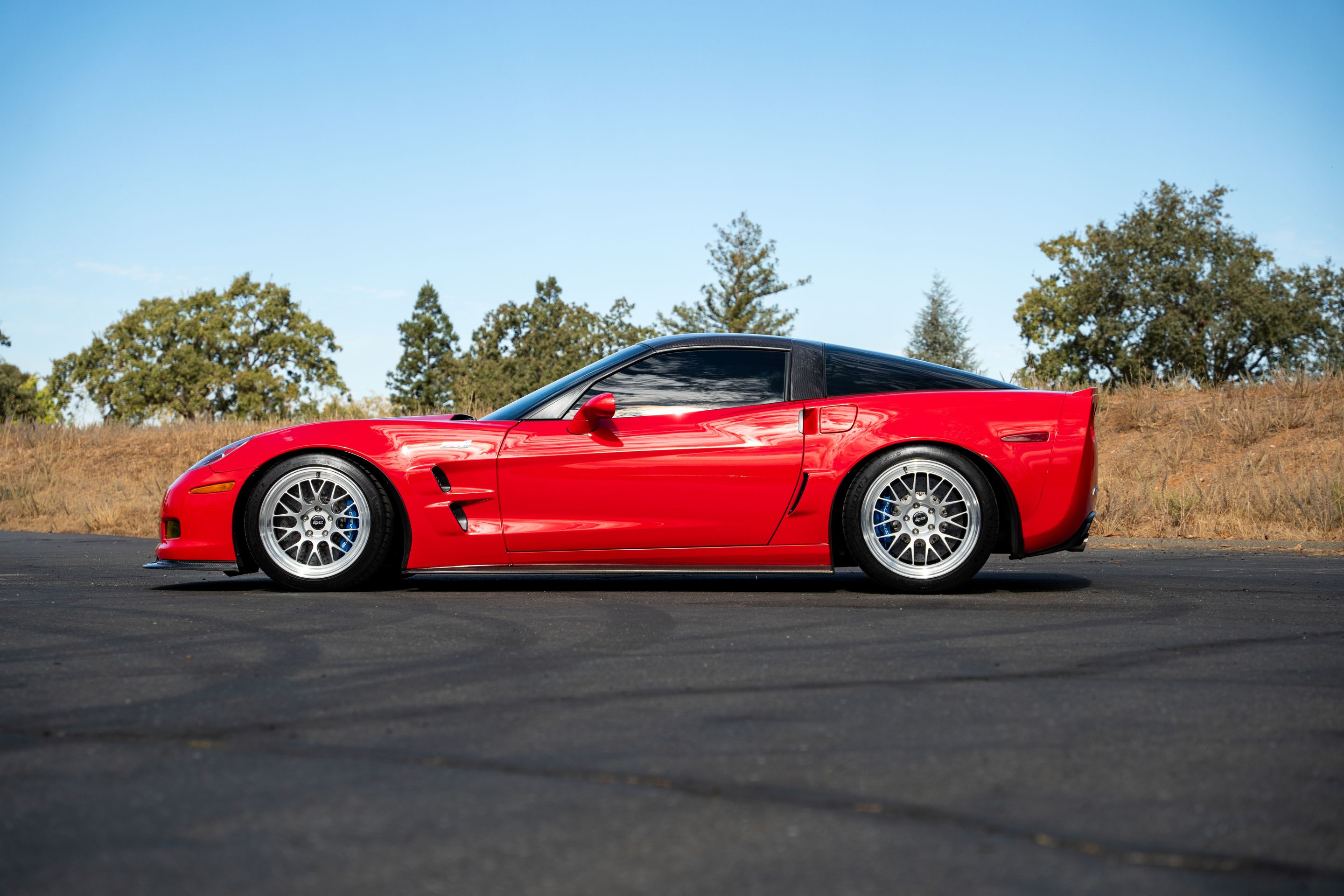 Red Chevrolet C6 Corvette ZR-1 with 18"/19" ML-10RT Apex wheels in Machined Lip Race Silver