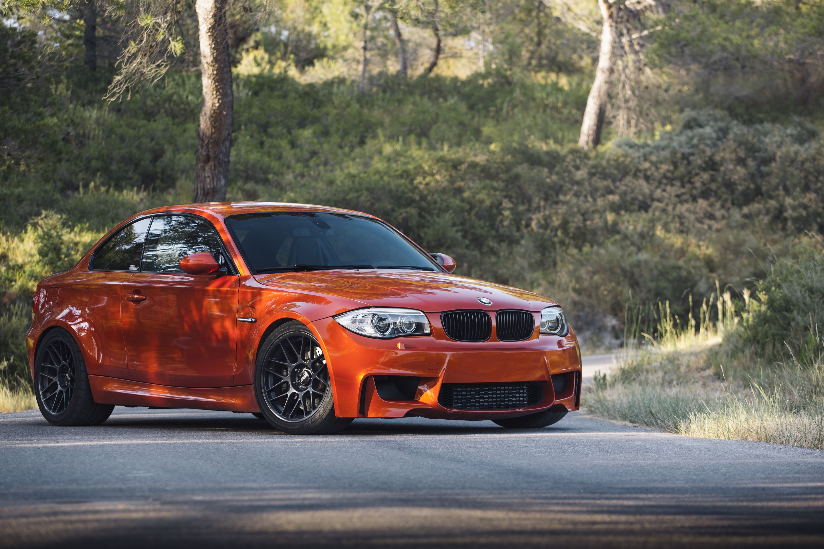 Orange BMW E82 1M with 18" ARC-8 Apex wheels in Satin Black