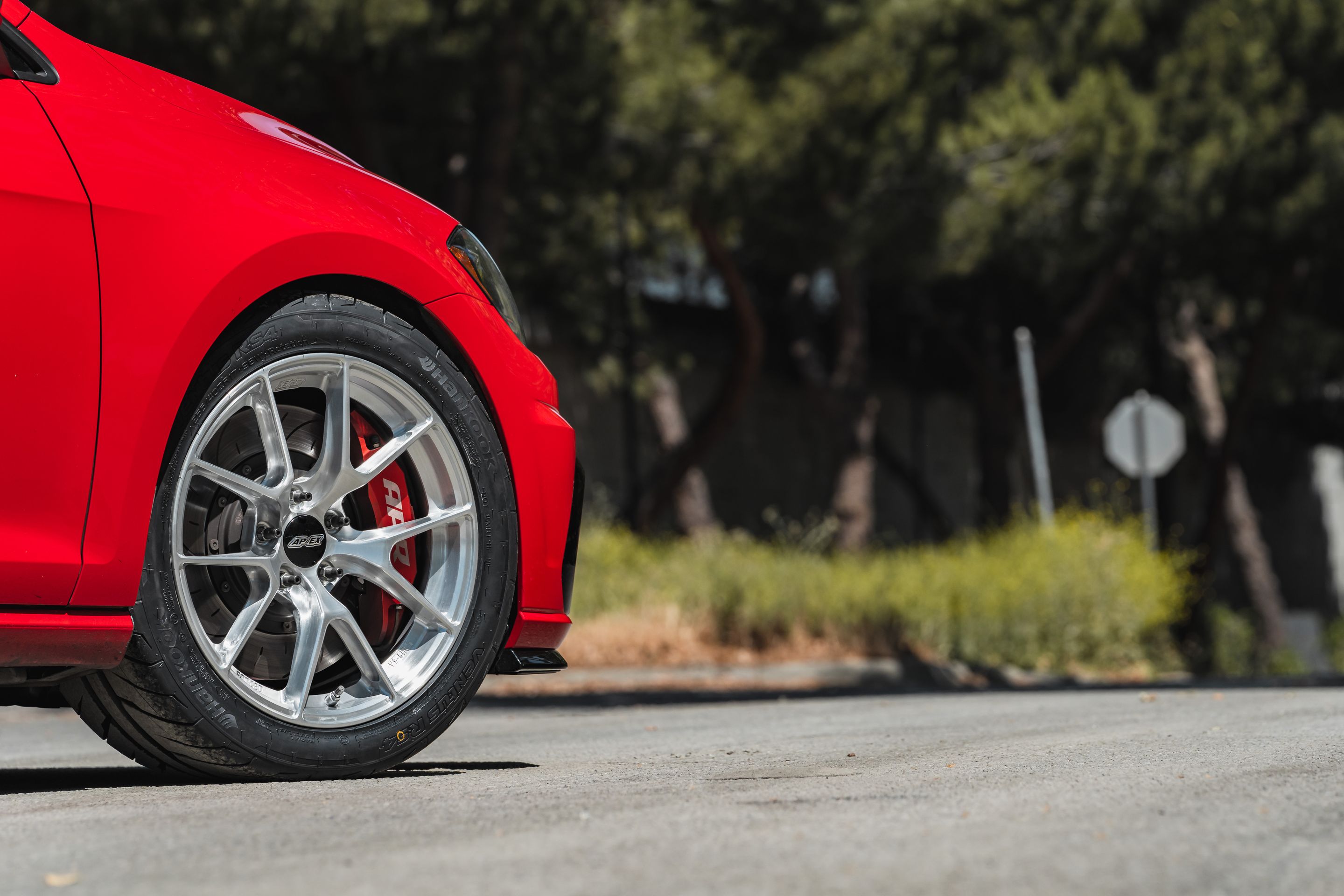 Red VW MK7 Alltrack/SportWagen Golf SportWagen with 17" VS-5RS Apex wheels in Brushed Clear