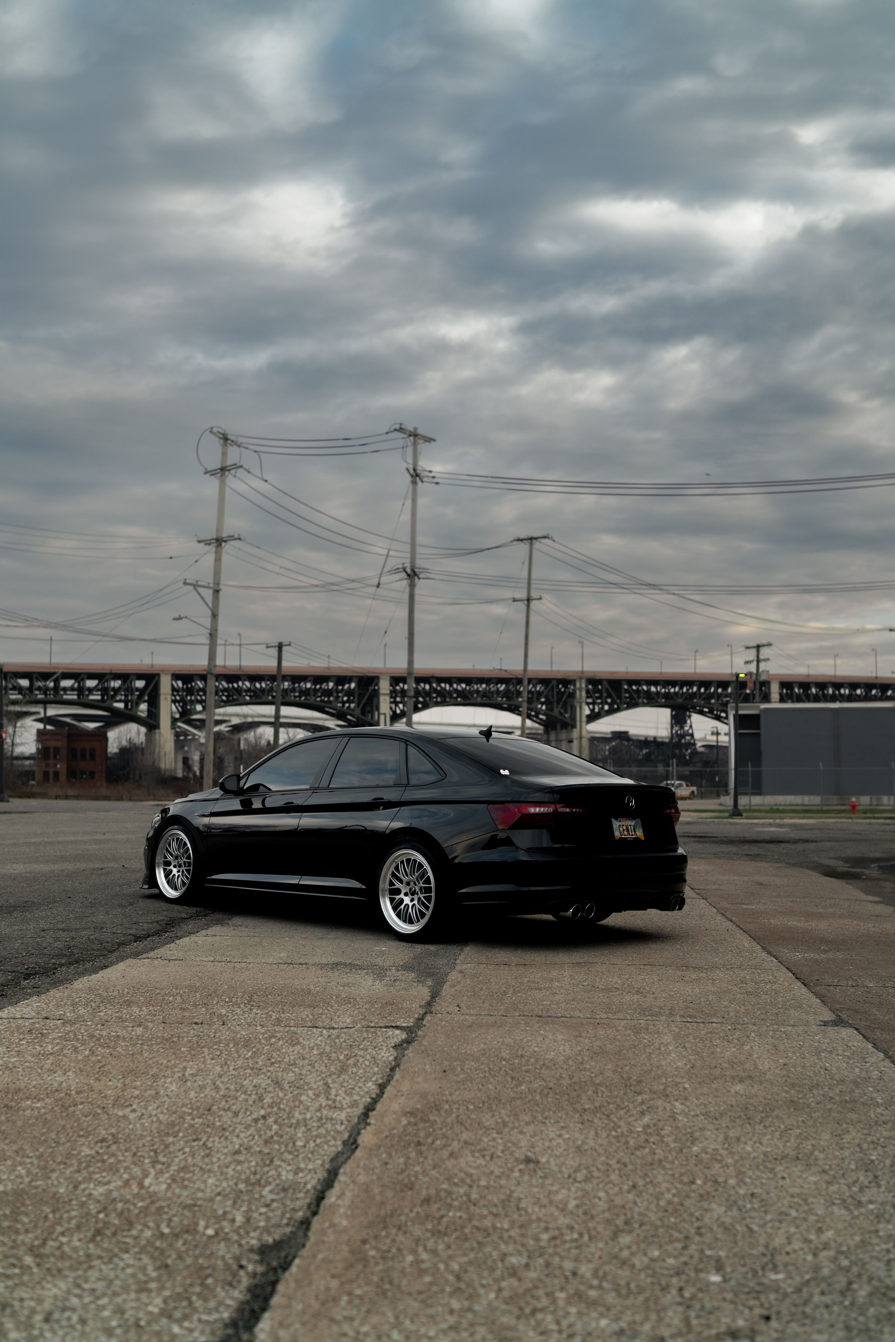 Black VW MK7 Jetta with 19" ML-10RT Apex wheels in Machined Lip Race Silver