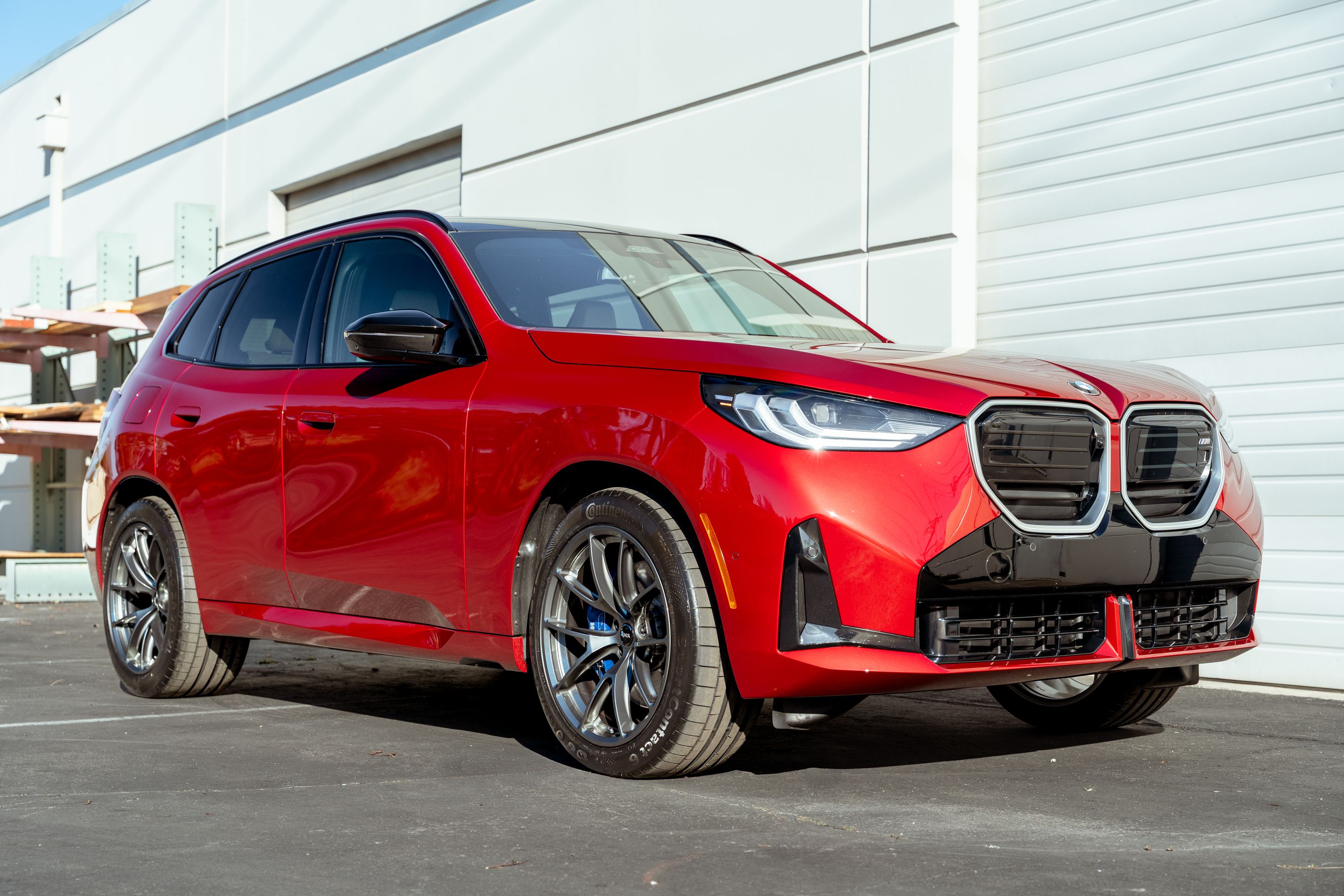 Red BMW G45 X3 with 20" VS-5RX Apex wheels in Anthracite