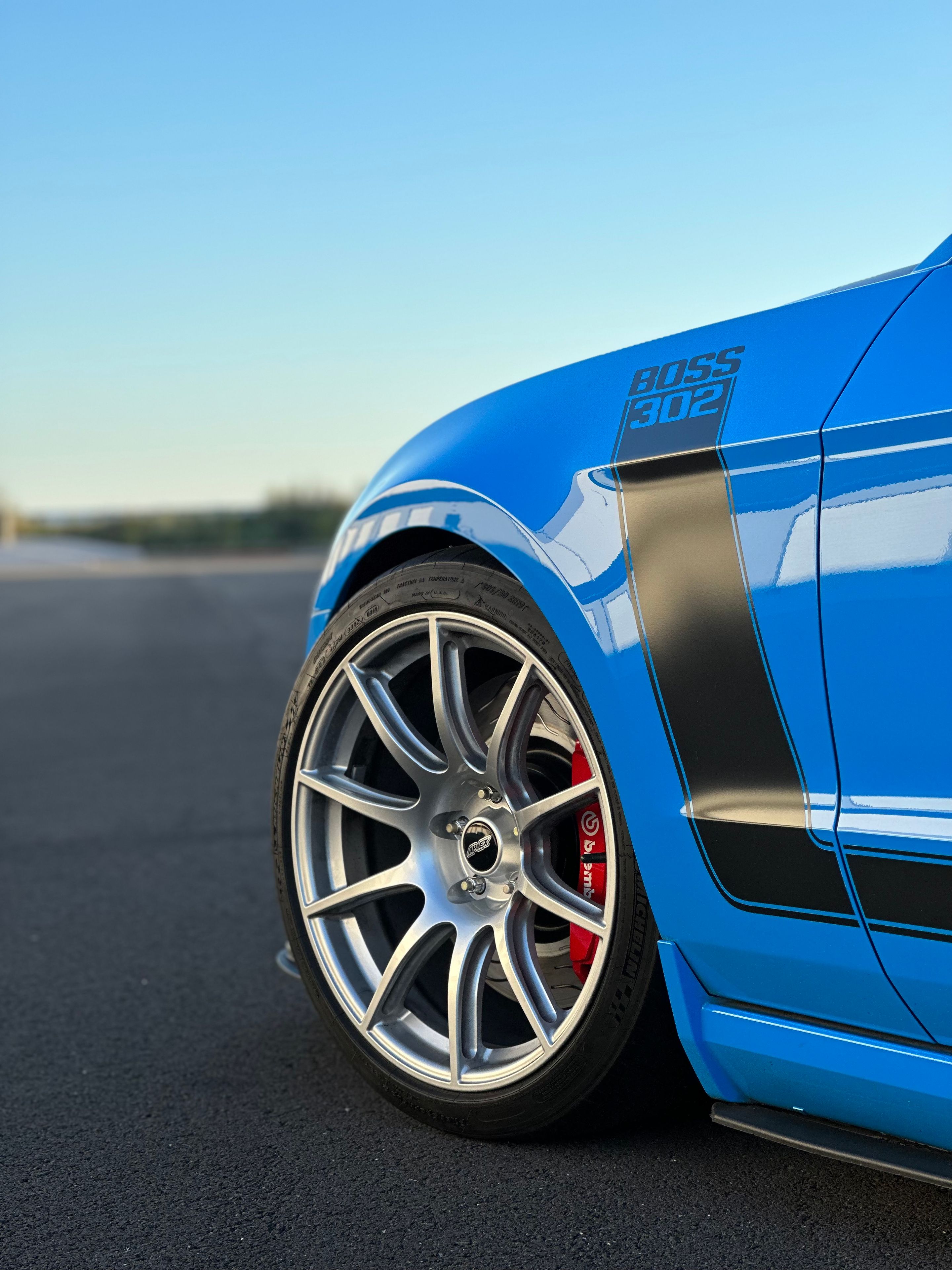Blue Ford S197 Mustang Boss 302 with 19" SM-10 Apex wheels in Race Silver