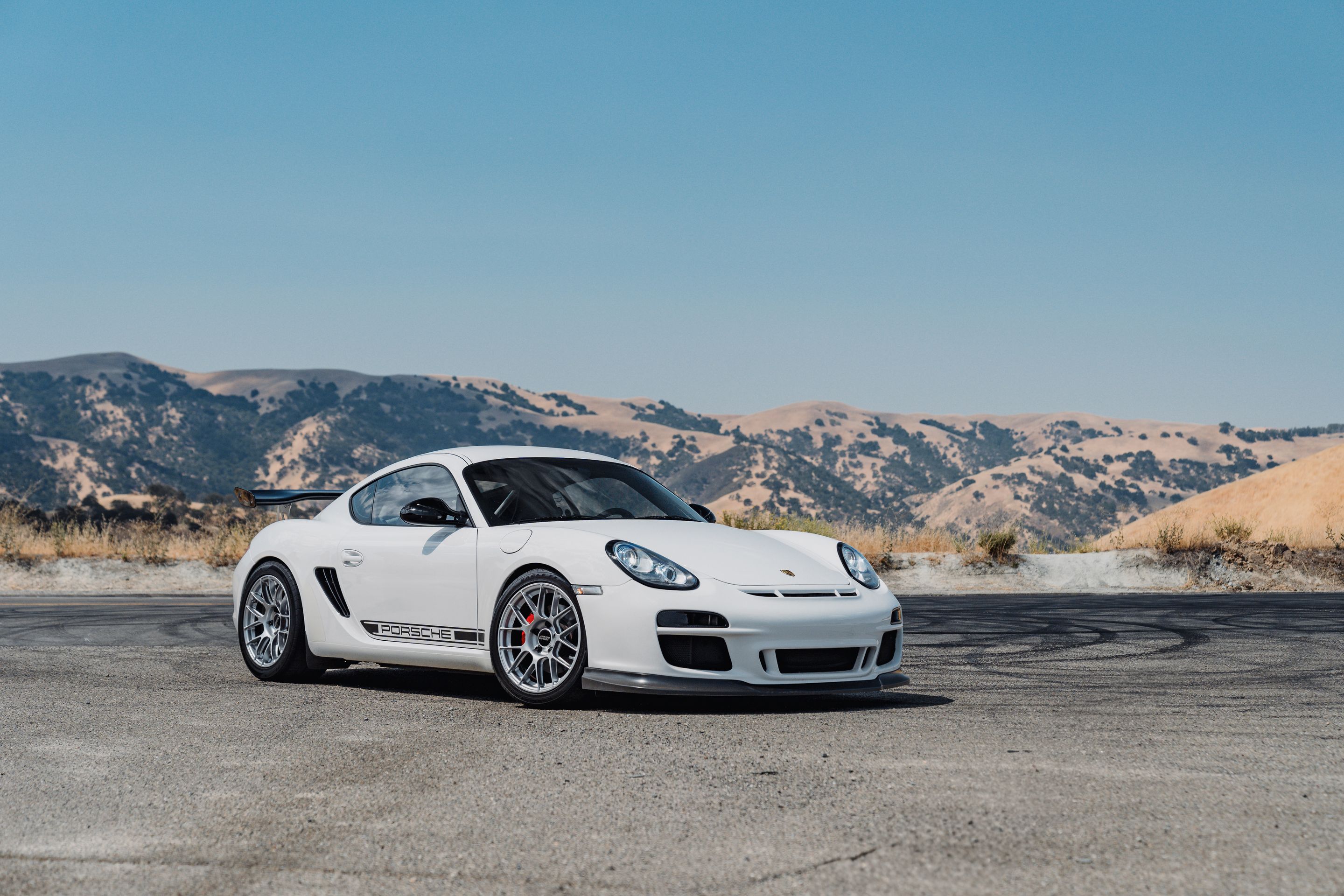 White Porsche 987 Cayman R with 18" EC-7RS Apex wheels in Race Silver