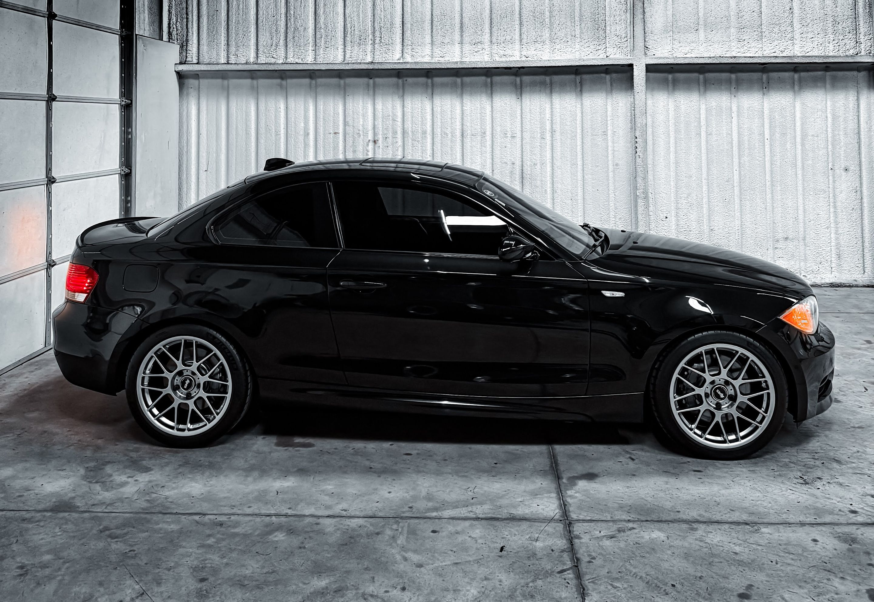 Black BMW E82 Coupe 1 Series with 18" ARC-8 Apex wheels in Hyper Black