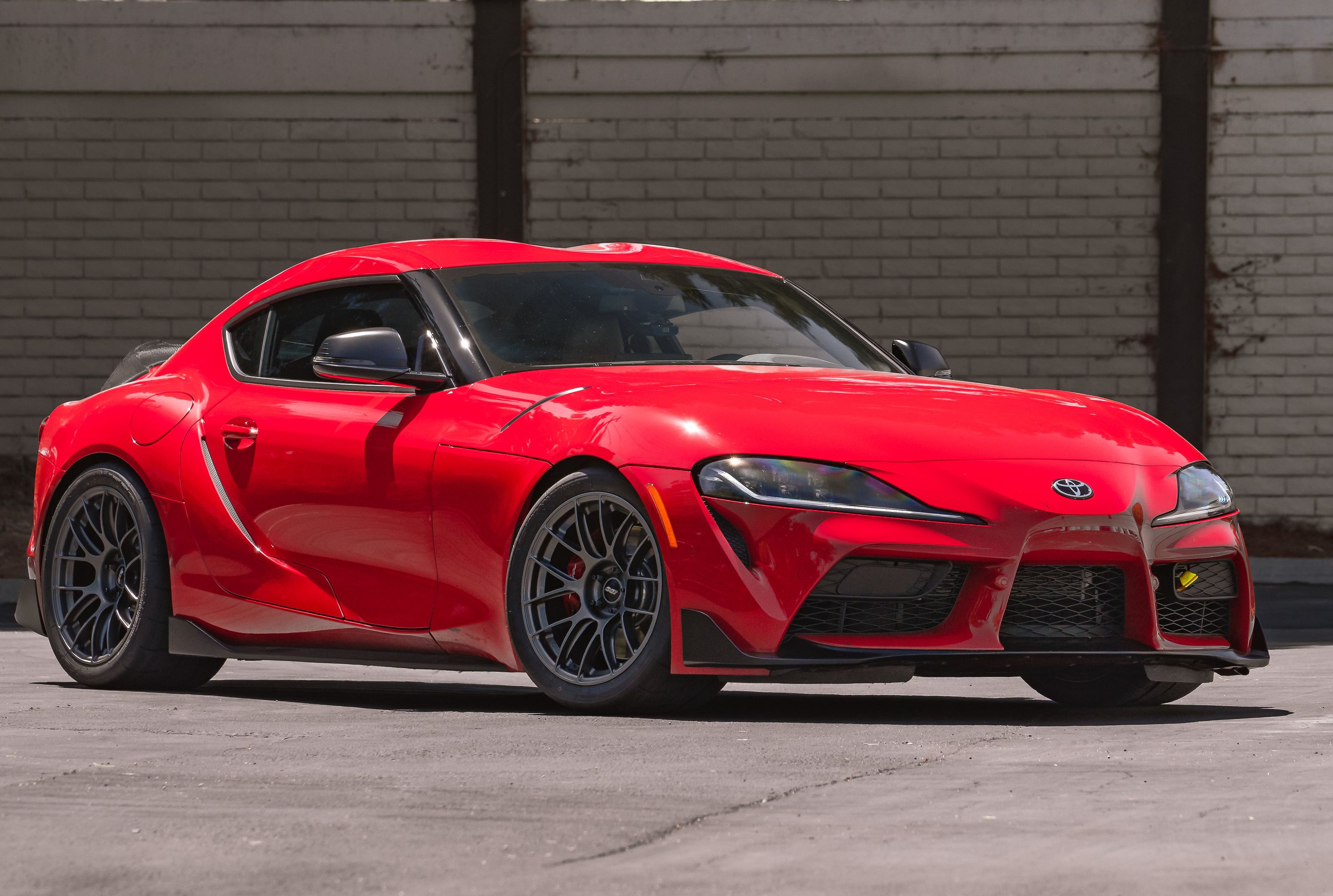 Red Toyota GR Supra with 18" EC-7RS Apex wheels in Anthracite