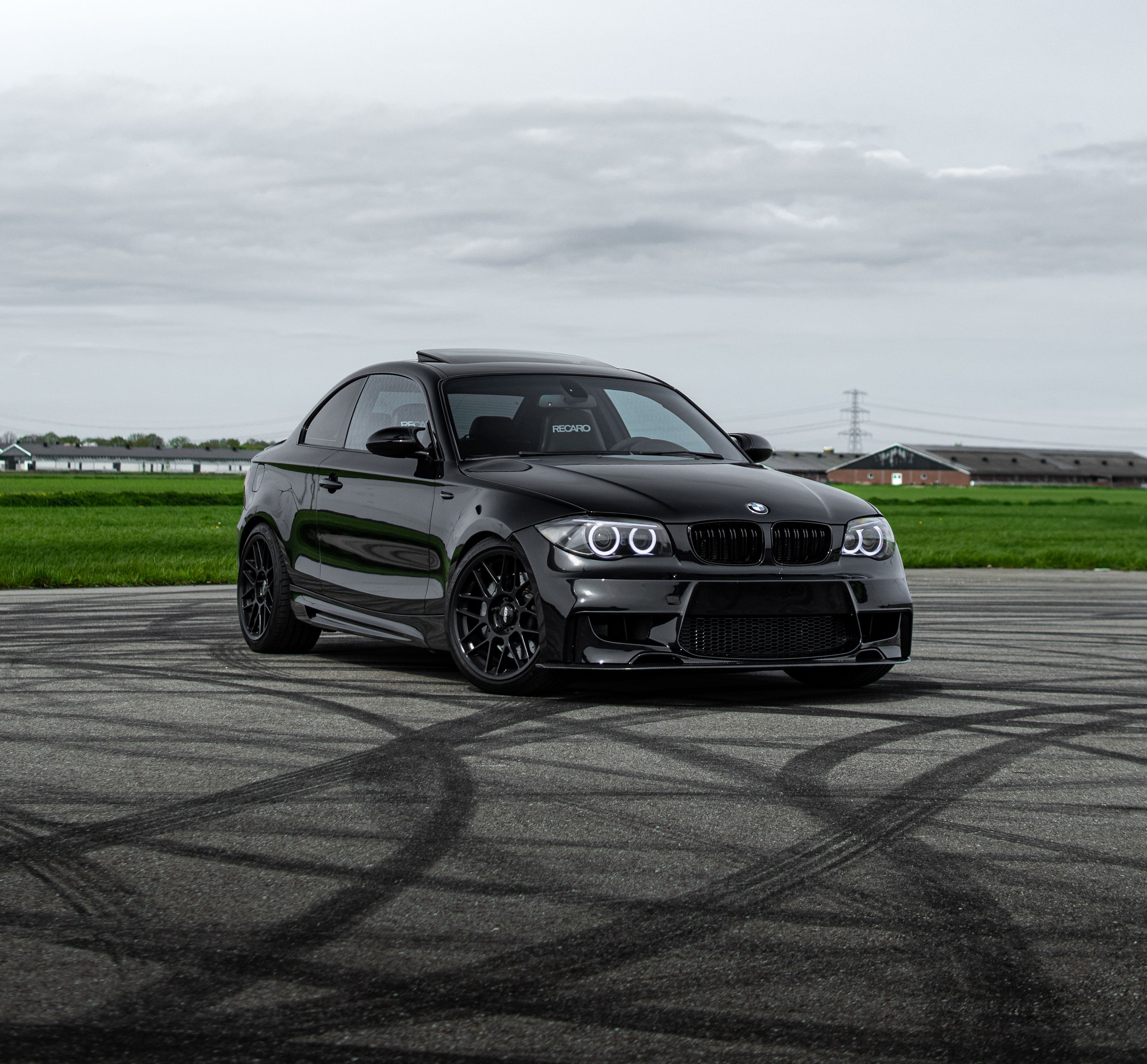 Black BMW E82 Coupe 1 Series with 18" ARC-8 Apex wheels in Satin Black