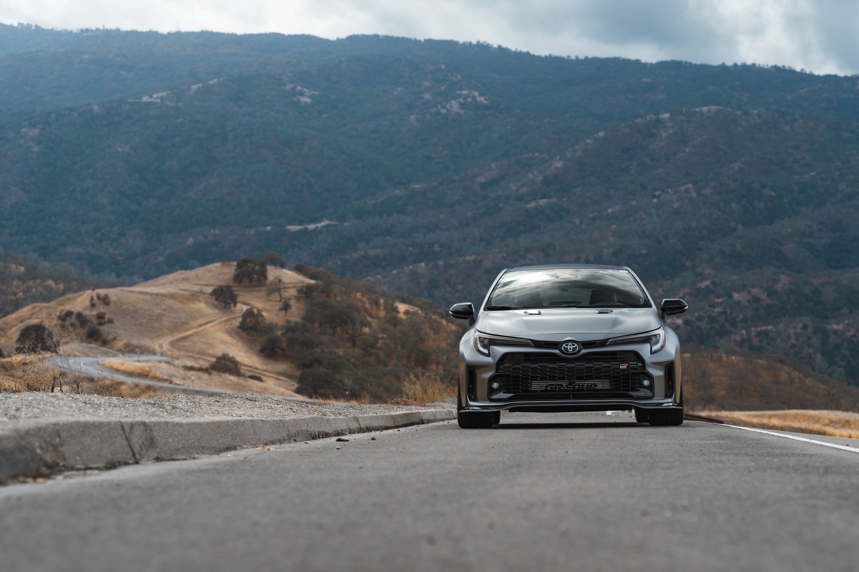 Grey Toyota GR Corolla with 18" SM-10RS Apex wheels in Satin Bronze
