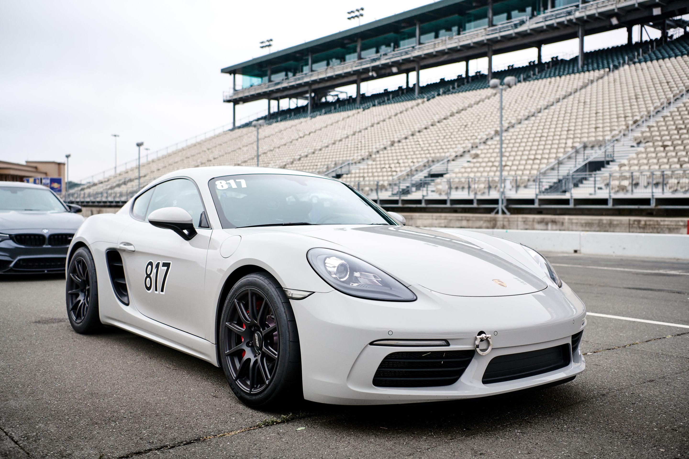 White Porsche 718 Cayman S with 18" SM-10 Apex wheels in Satin Black