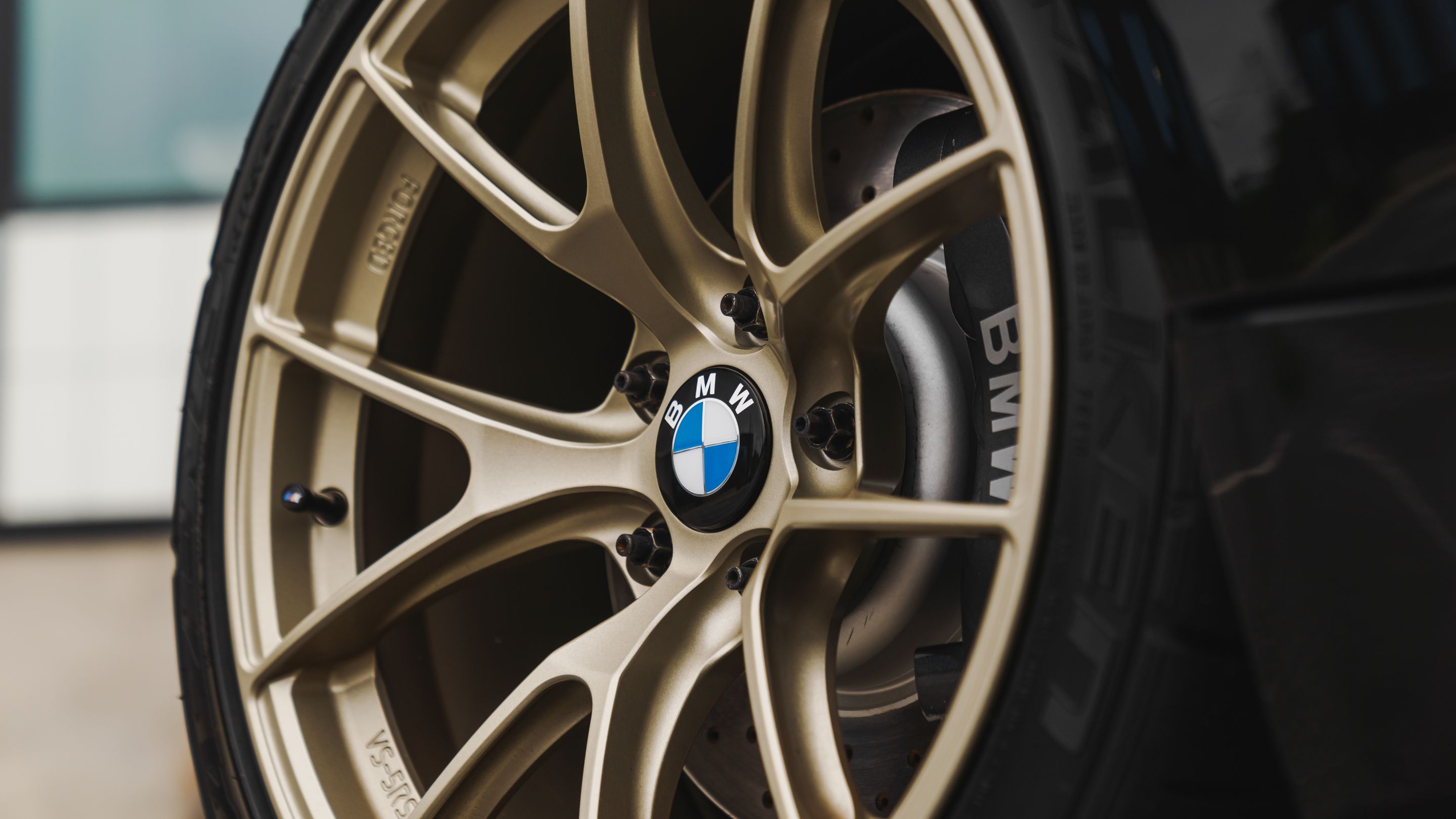 Black BMW E82 Coupe 1 Series with 18" VS-5RS Apex wheels in Motorsport Gold