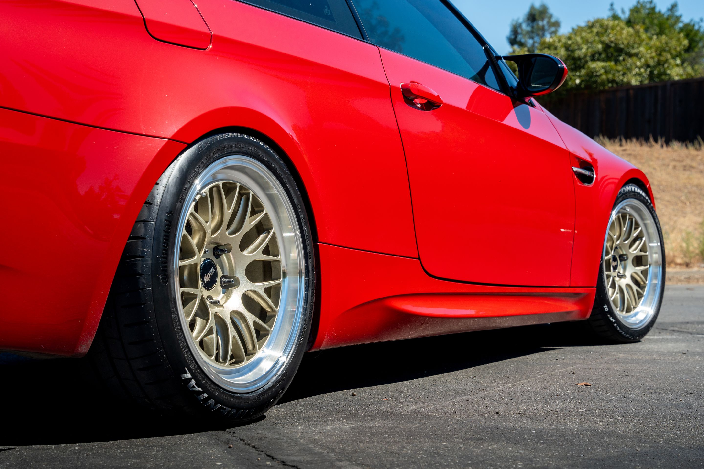 Red BMW E92 Coupe M3 with 18" ML-10RT Apex wheels in Machined Lip Gloss Motorsport Gold
