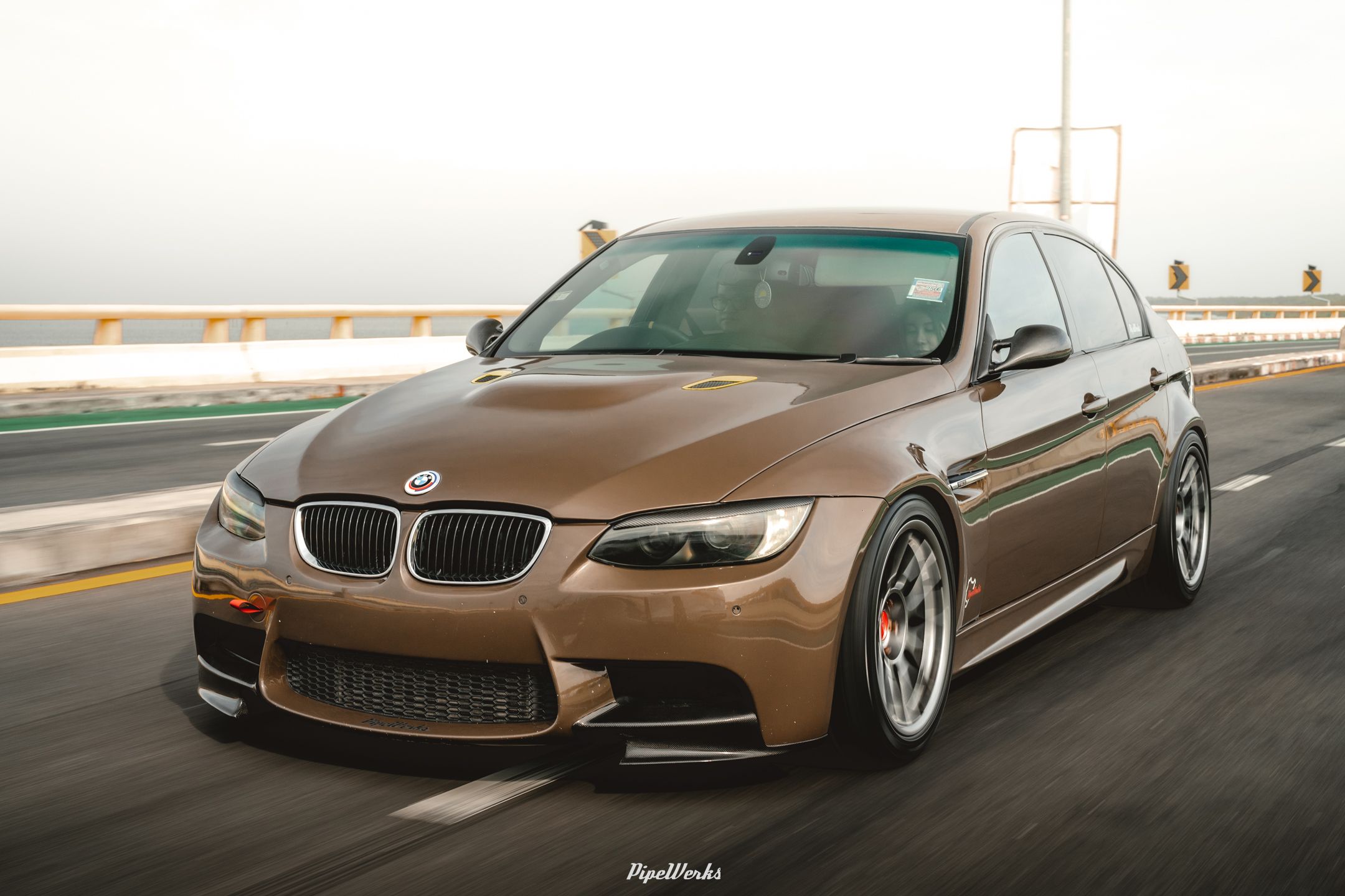 Brown BMW E90 Sedan 3 Series with 18" ARC-8 Apex wheels in Hyper Black