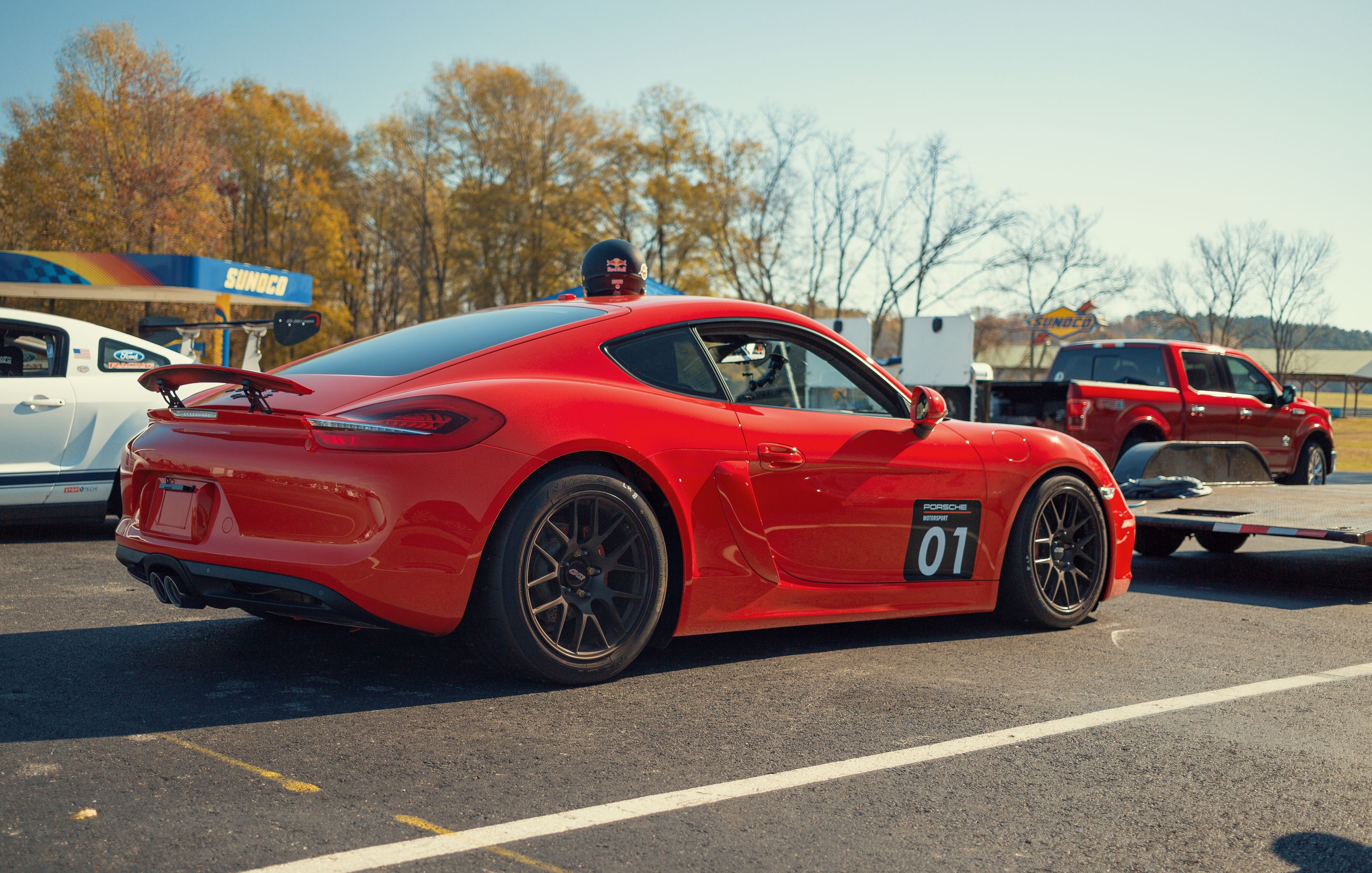 Red Porsche 981 Cayman S with 18" EC-7R Apex wheels in Satin Black