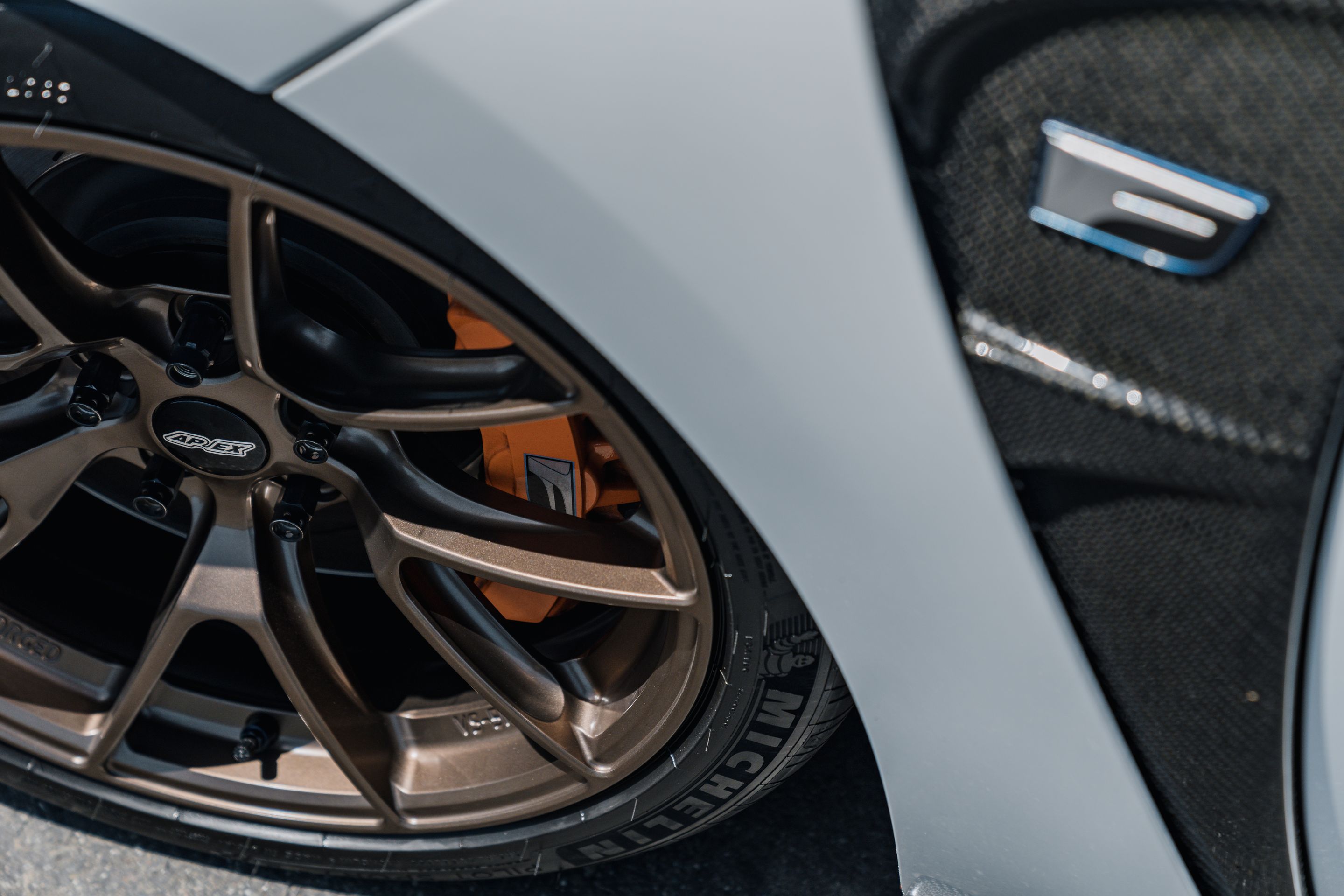 White Lexus URL10 GS-F with 18" VS-5RS Apex wheels in Satin Bronze