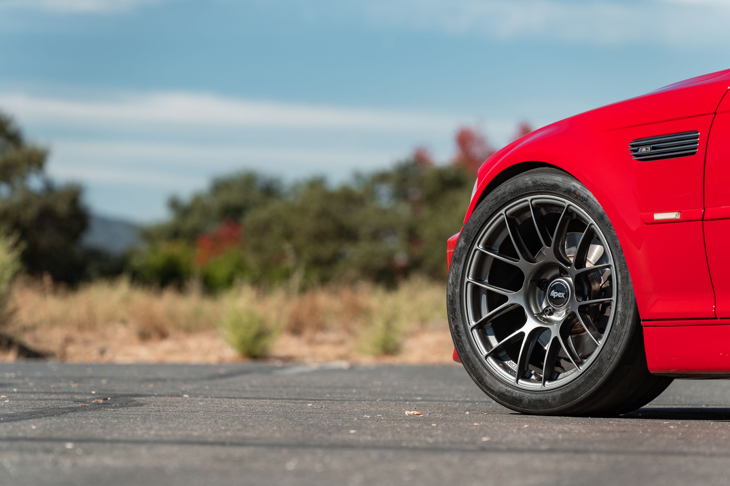 Red BMW E46 M3 with 18" EC-7RS Apex wheels in Anthracite