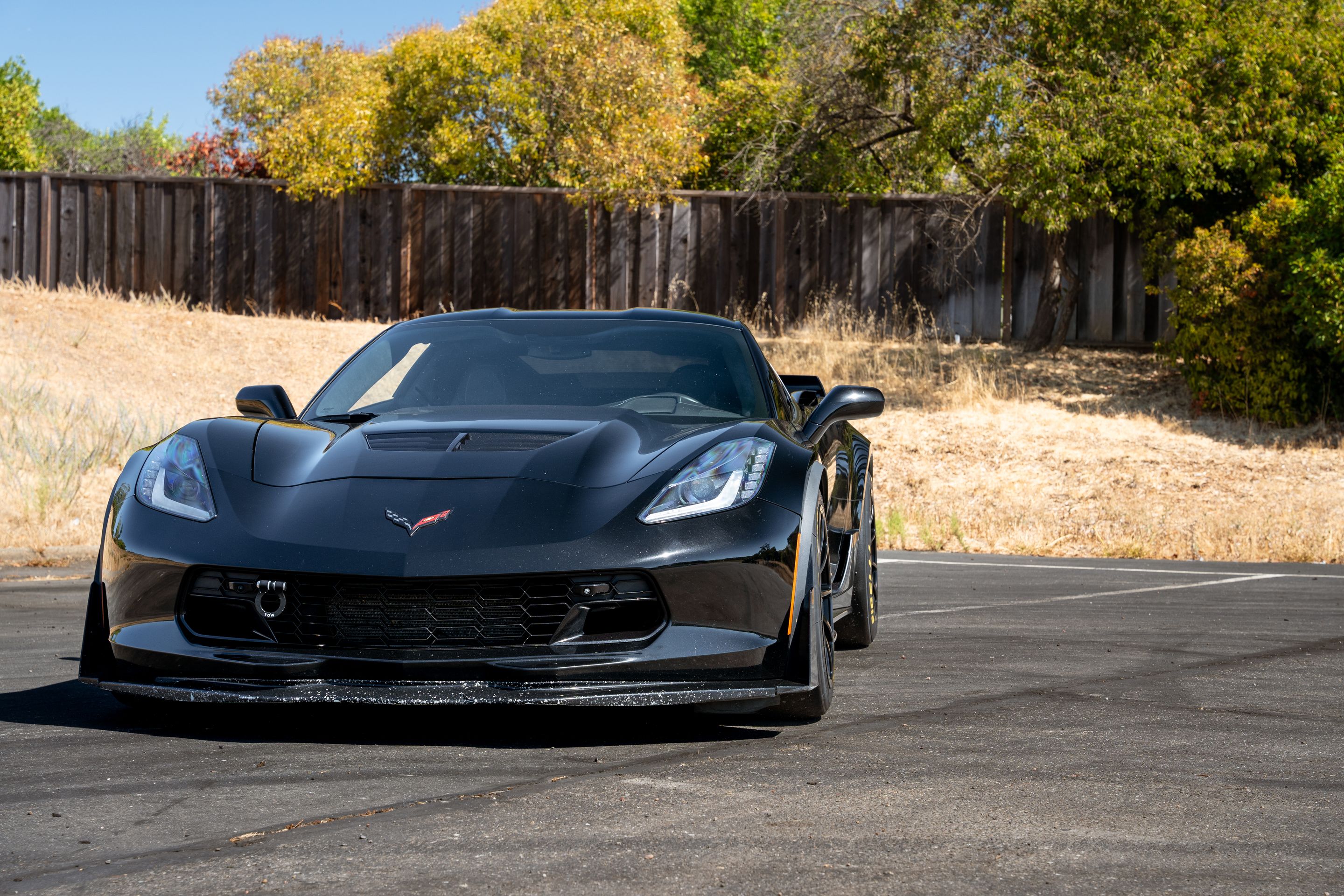 Black Chevrolet C7 Corvette Z06 with 18" SM-10RE Apex wheels in Satin Black