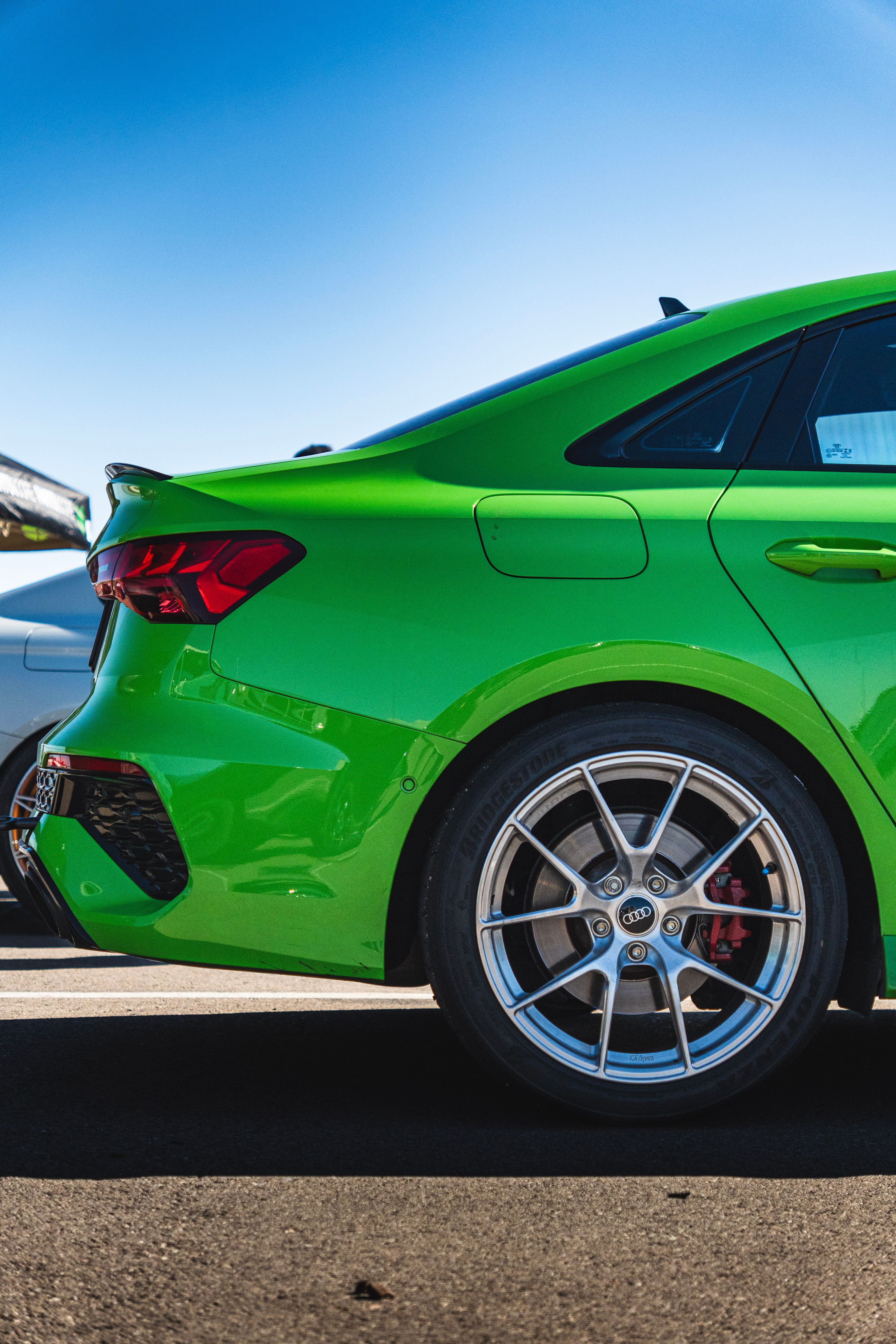 Green Audi 8Y RS 3 with 18" VS-5RS Apex wheels in Brushed Clear