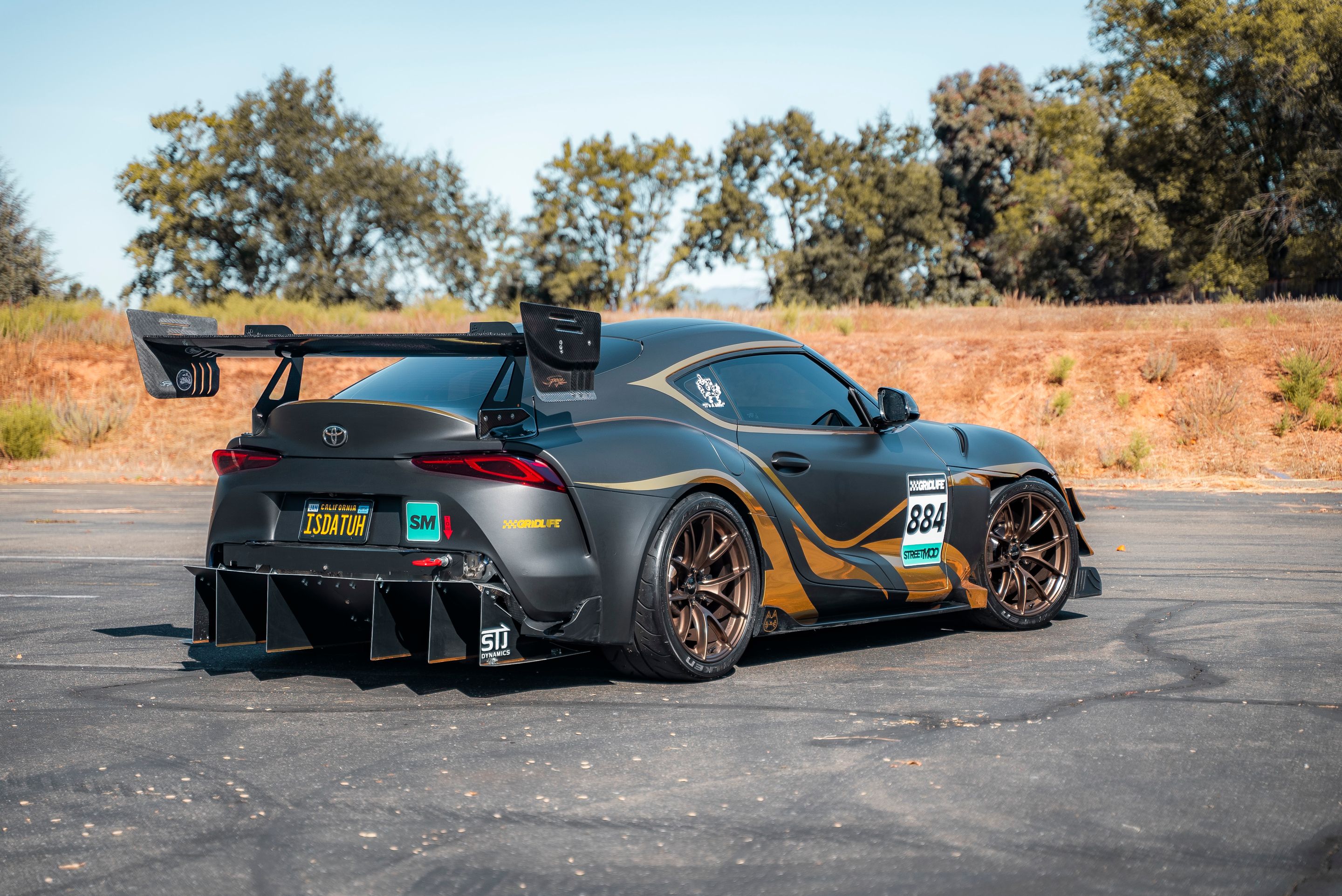 Grey Toyota GR Supra with 19" VS-5RS Apex wheels in Satin Bronze