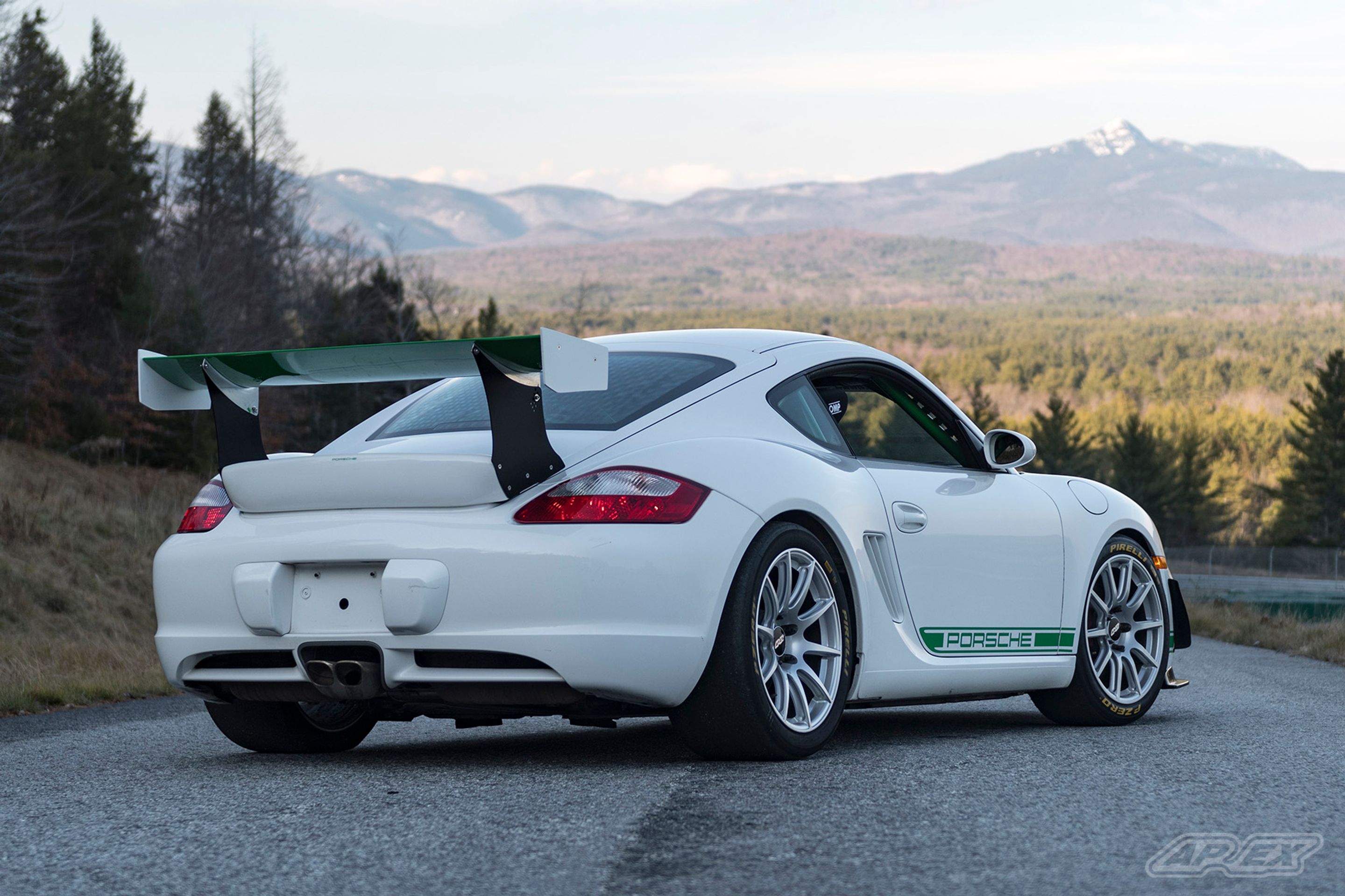White Porsche 987 Cayman S with 18" SM-10 Apex wheels in Race Silver