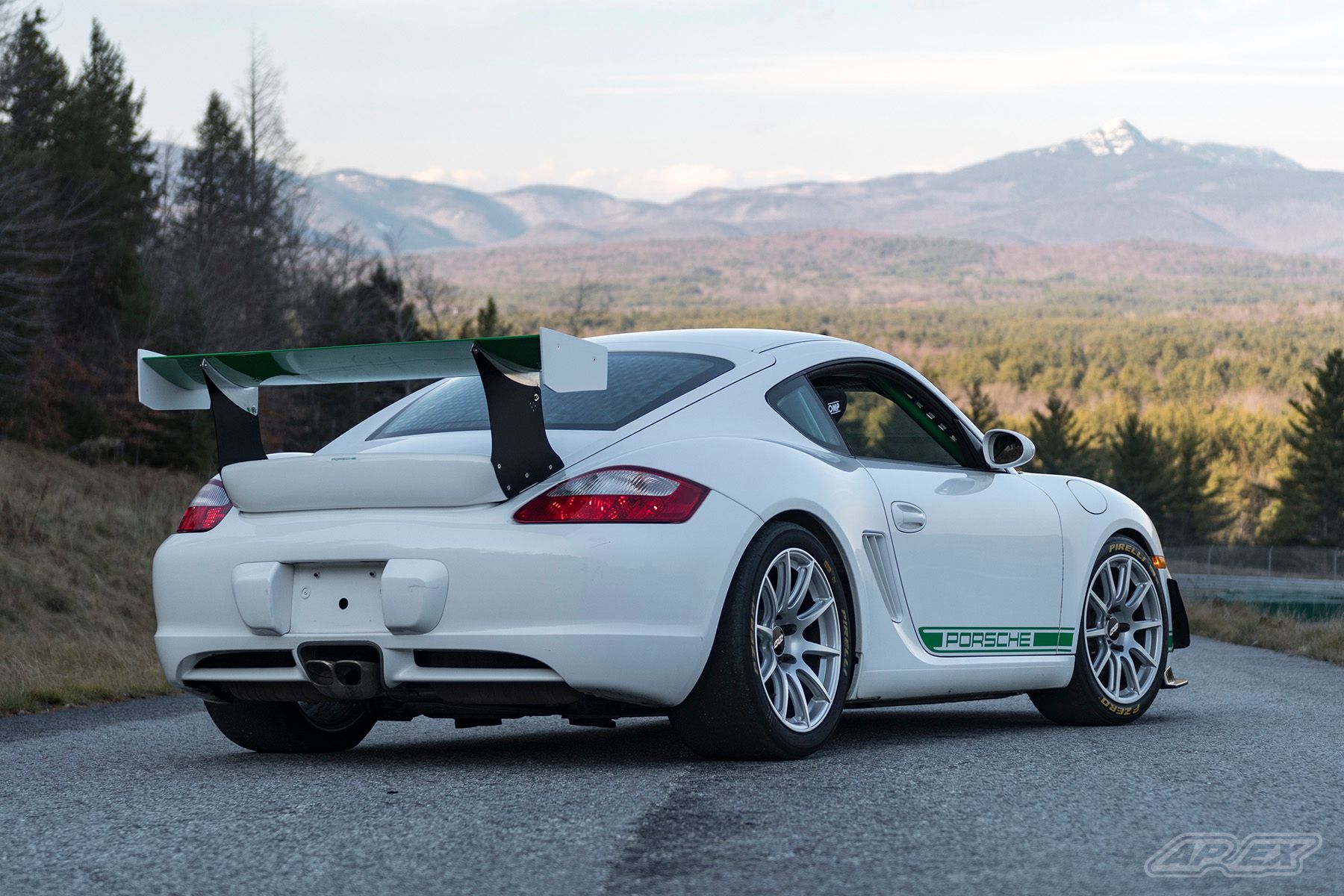 White Porsche 987 Cayman S with 18" SM-10 Apex wheels in Race Silver