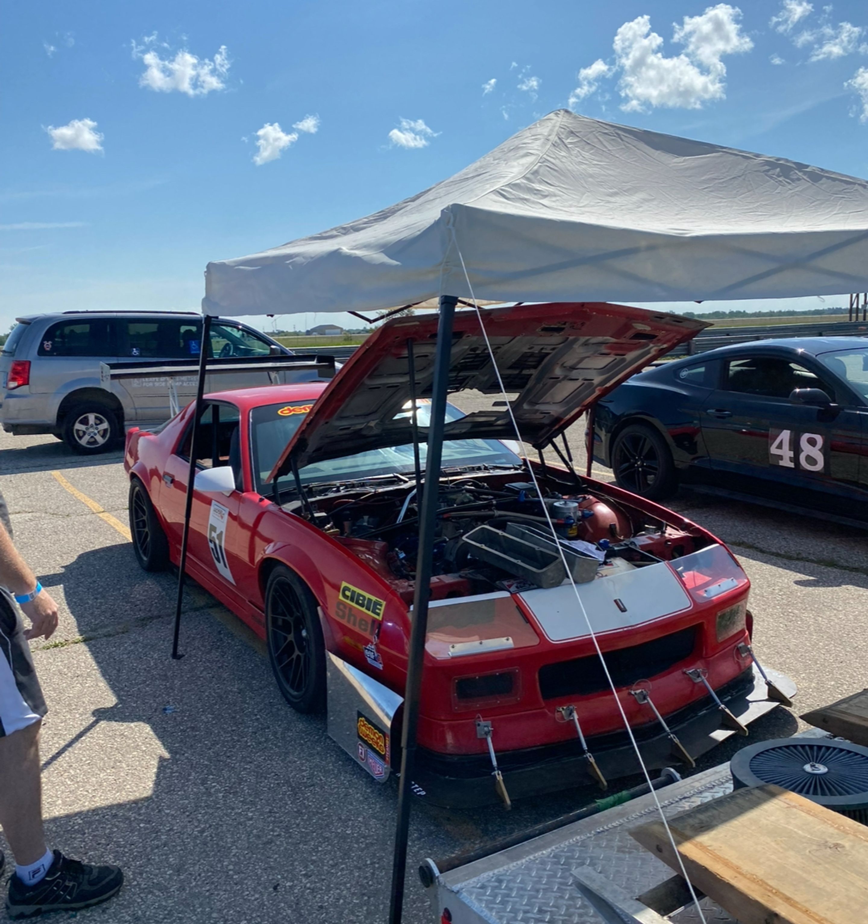 Red Chevrolet 5th Gen Camaro SS with 18" ARC-8 Apex wheels in Satin Black
