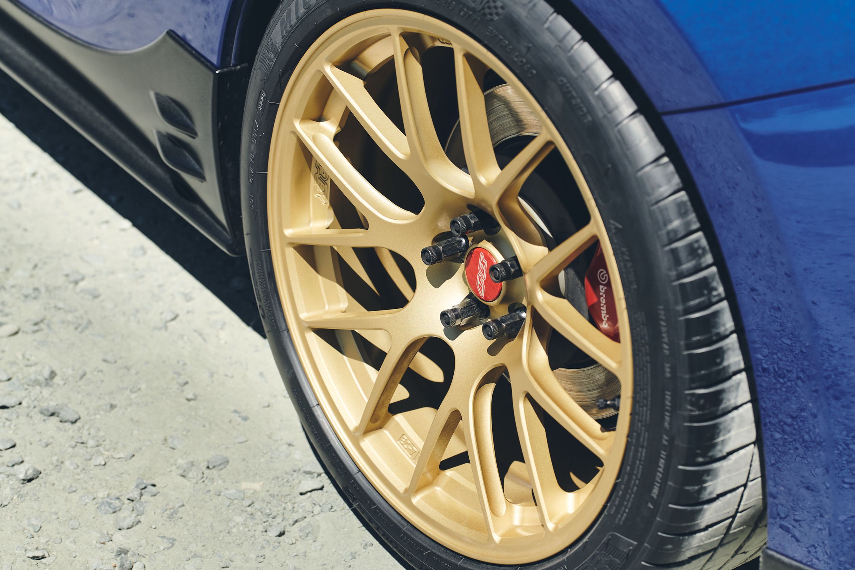 Blue Subaru ZC6 / Gen 1 BRZ with 17" EC-7R Apex wheels in Satin Gold