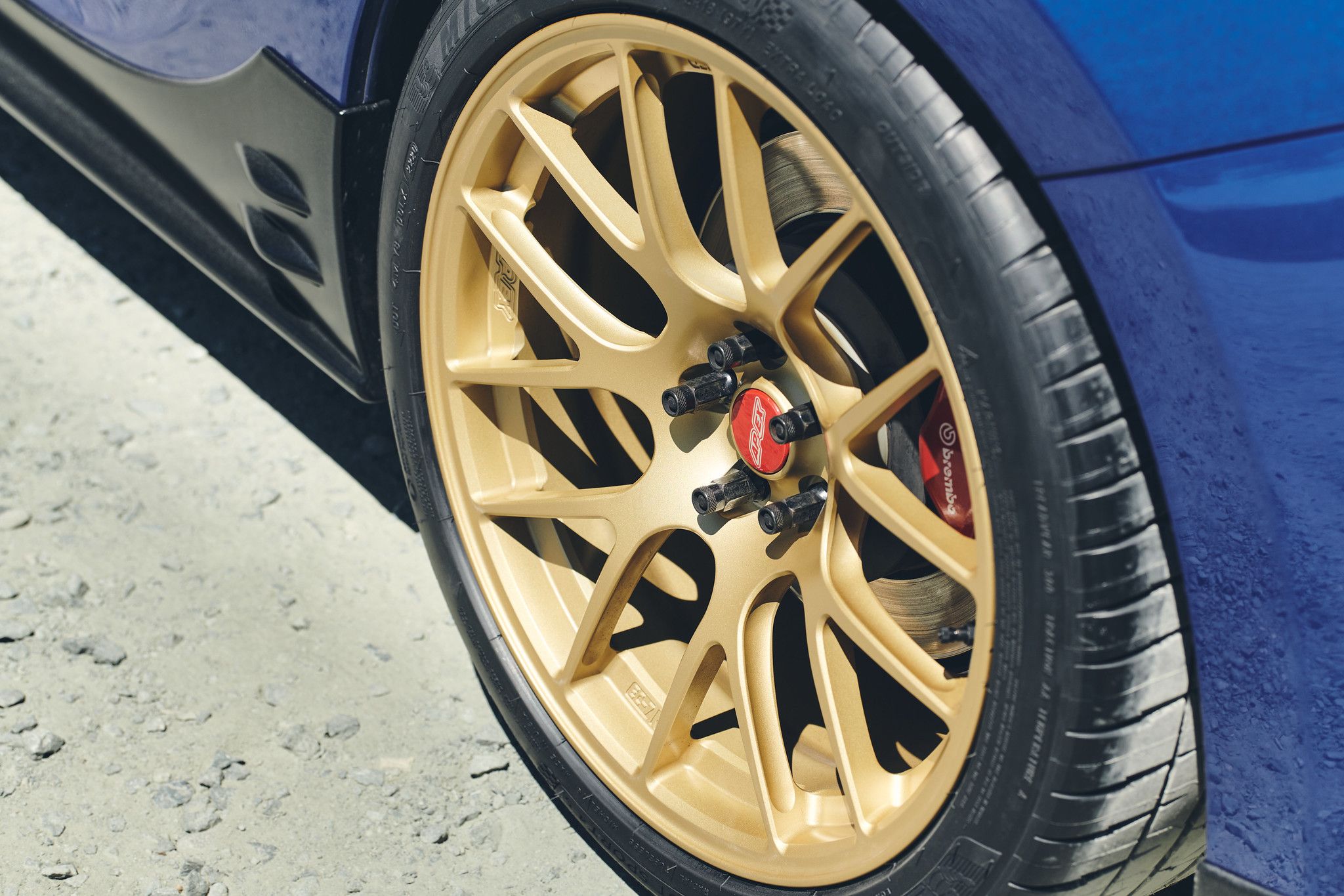 Blue Subaru ZC6 / Gen 1 BRZ with 17" EC-7R Apex wheels in Satin Gold