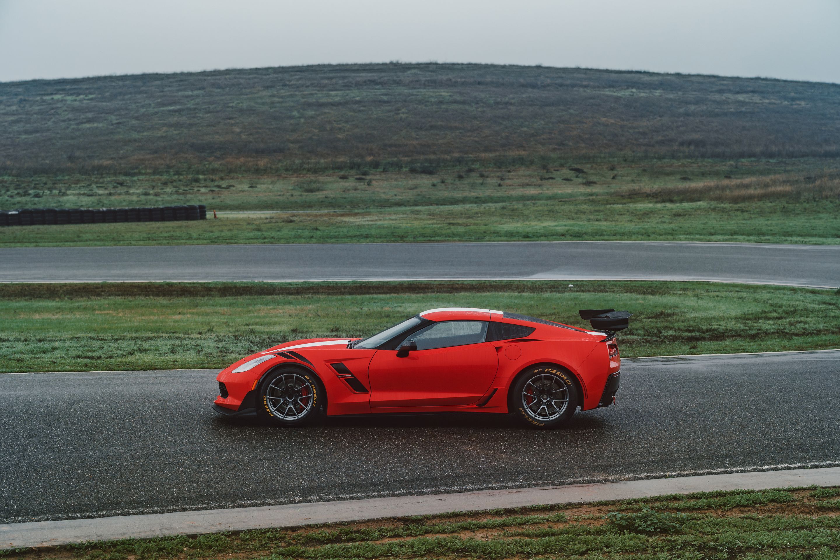 Red Chevrolet C7 Corvette Grand Sport with 18" VS-5RE Apex wheels in Anthracite