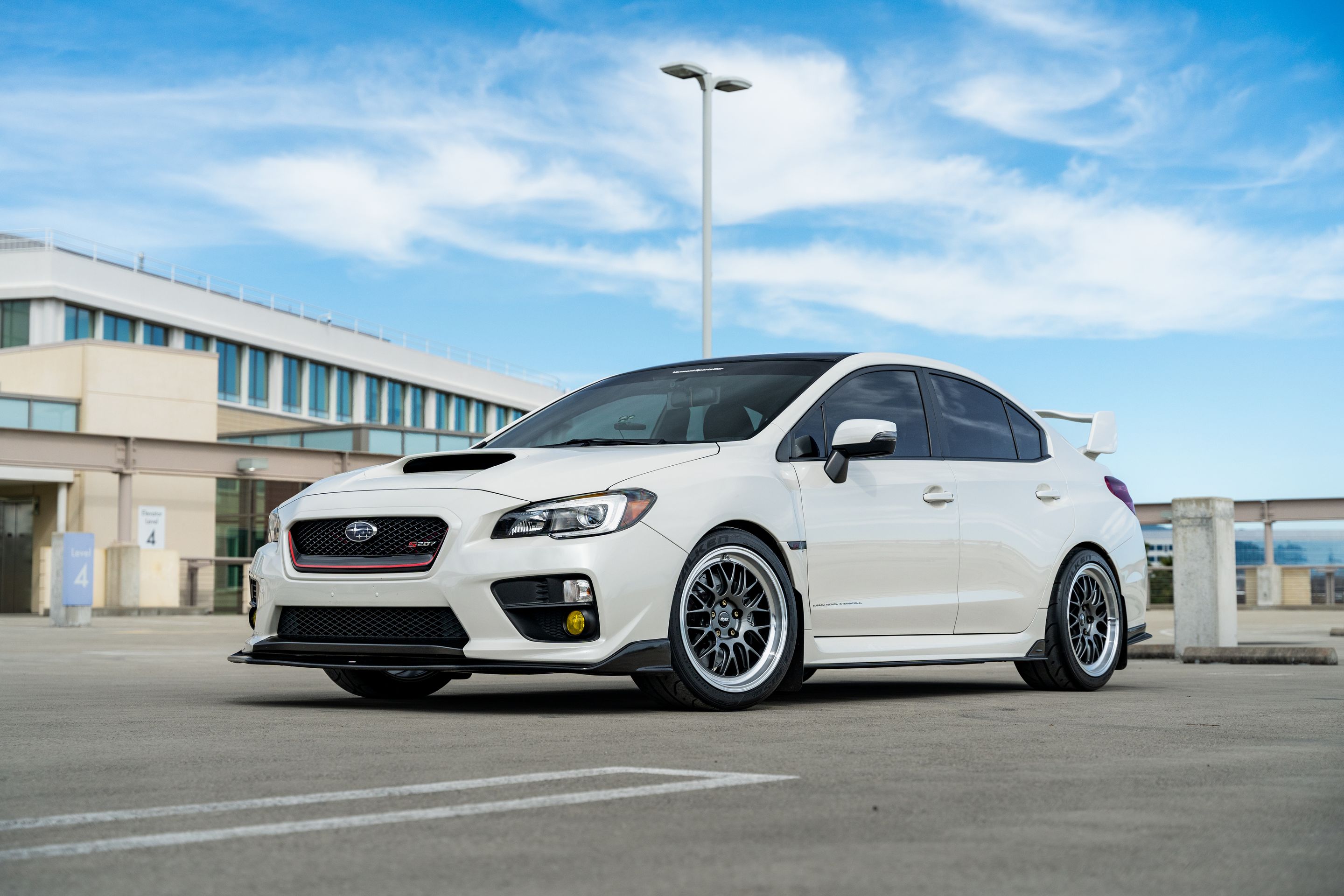 White Subaru VA WRX STI with 18" ML-10RT Apex wheels in Machined Lip Anthracite