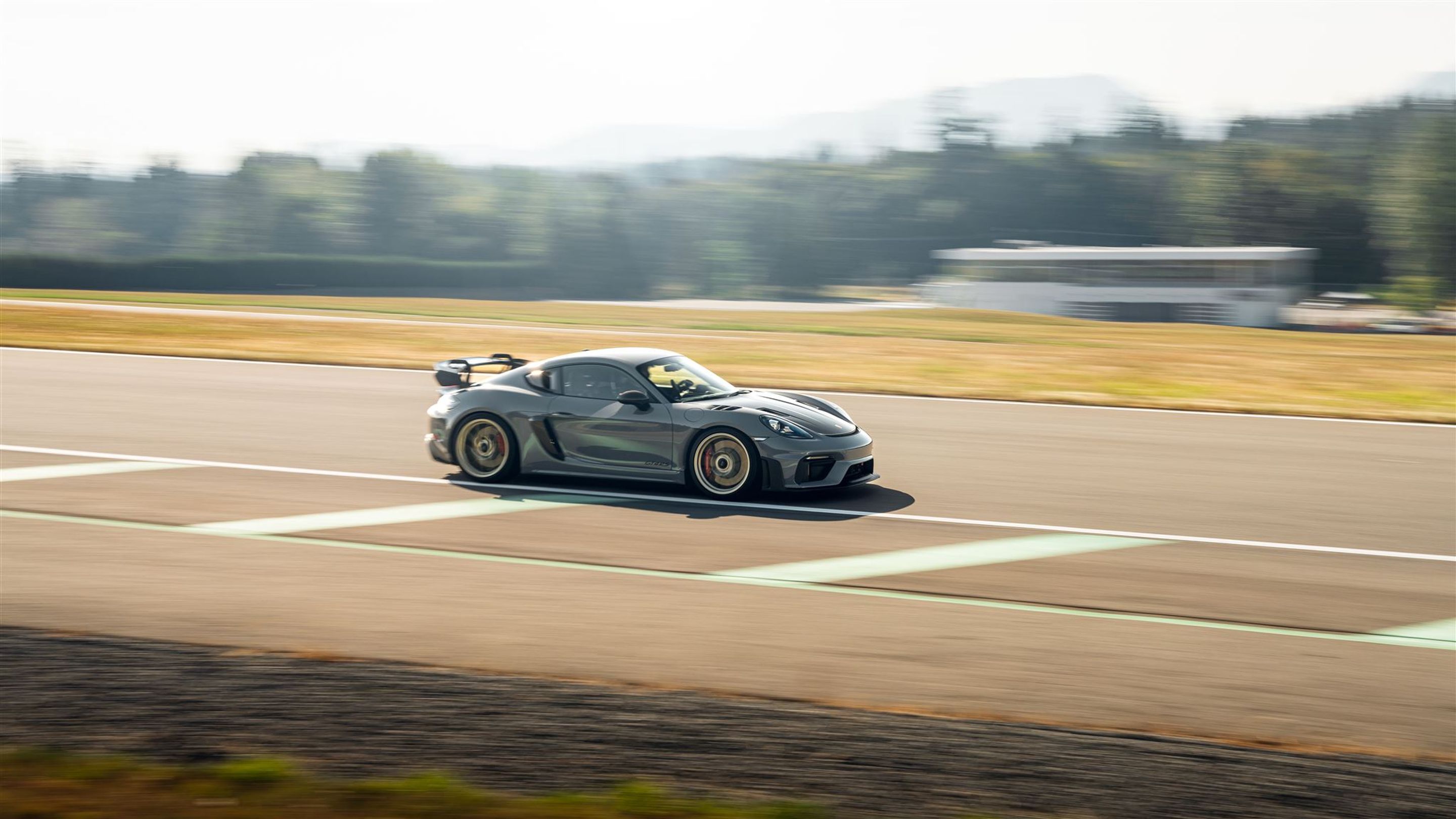 Grey Porsche 718 Cayman GT4 RS with 20" VS-5RS Apex wheels in Motorsport Gold