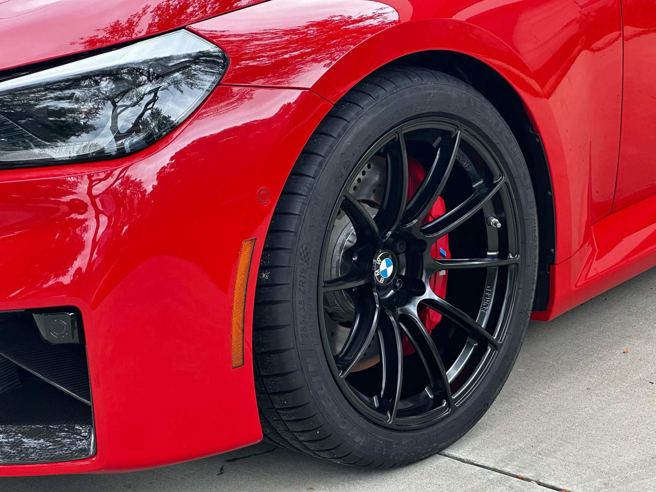 Red BMW G87 M2 with 19"/20" SM-10RS Apex wheels in Satin Black