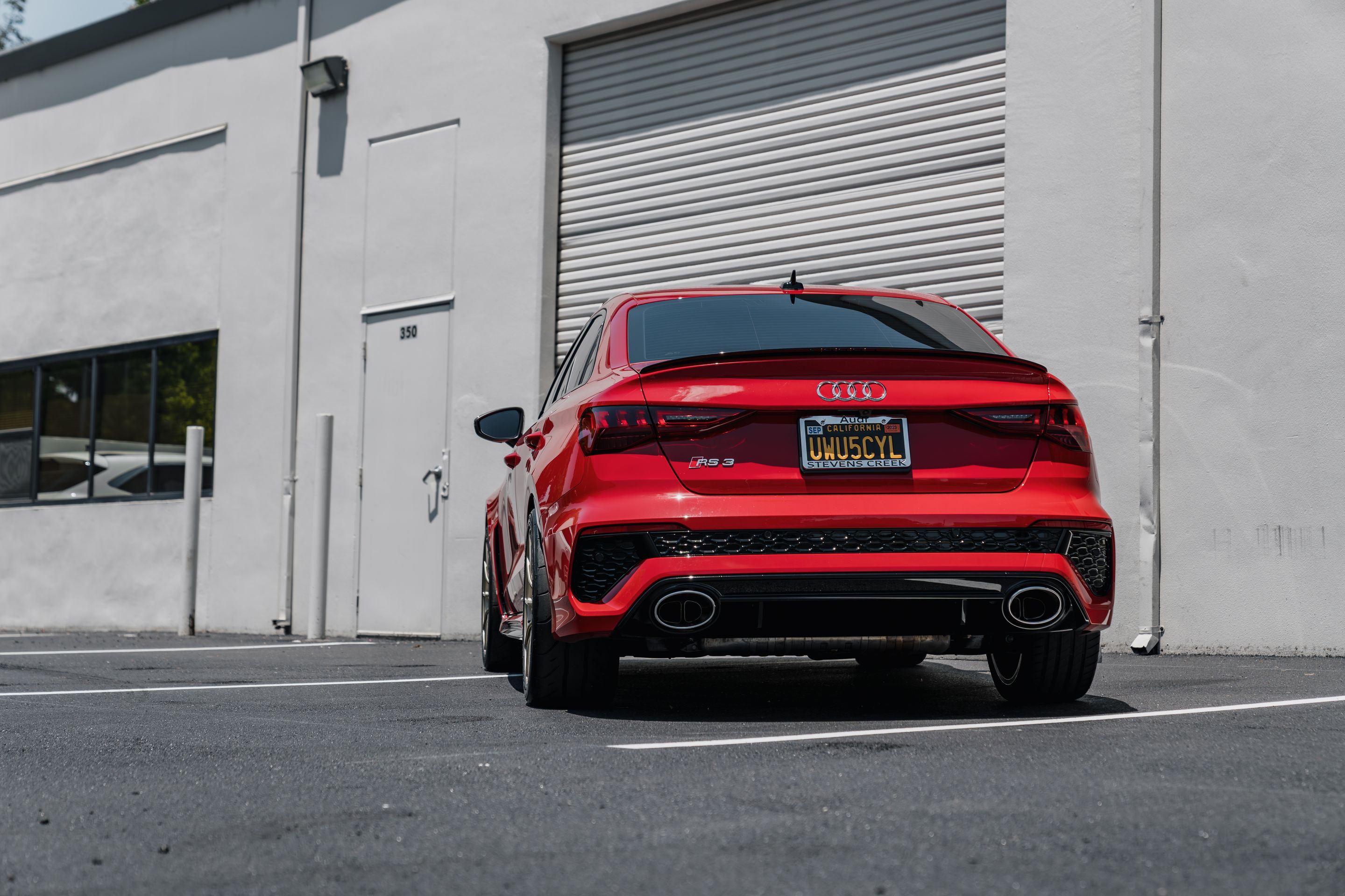 Red Audi 8Y RS 3 with 18" SM-10RS Apex wheels in Motorsport Gold
