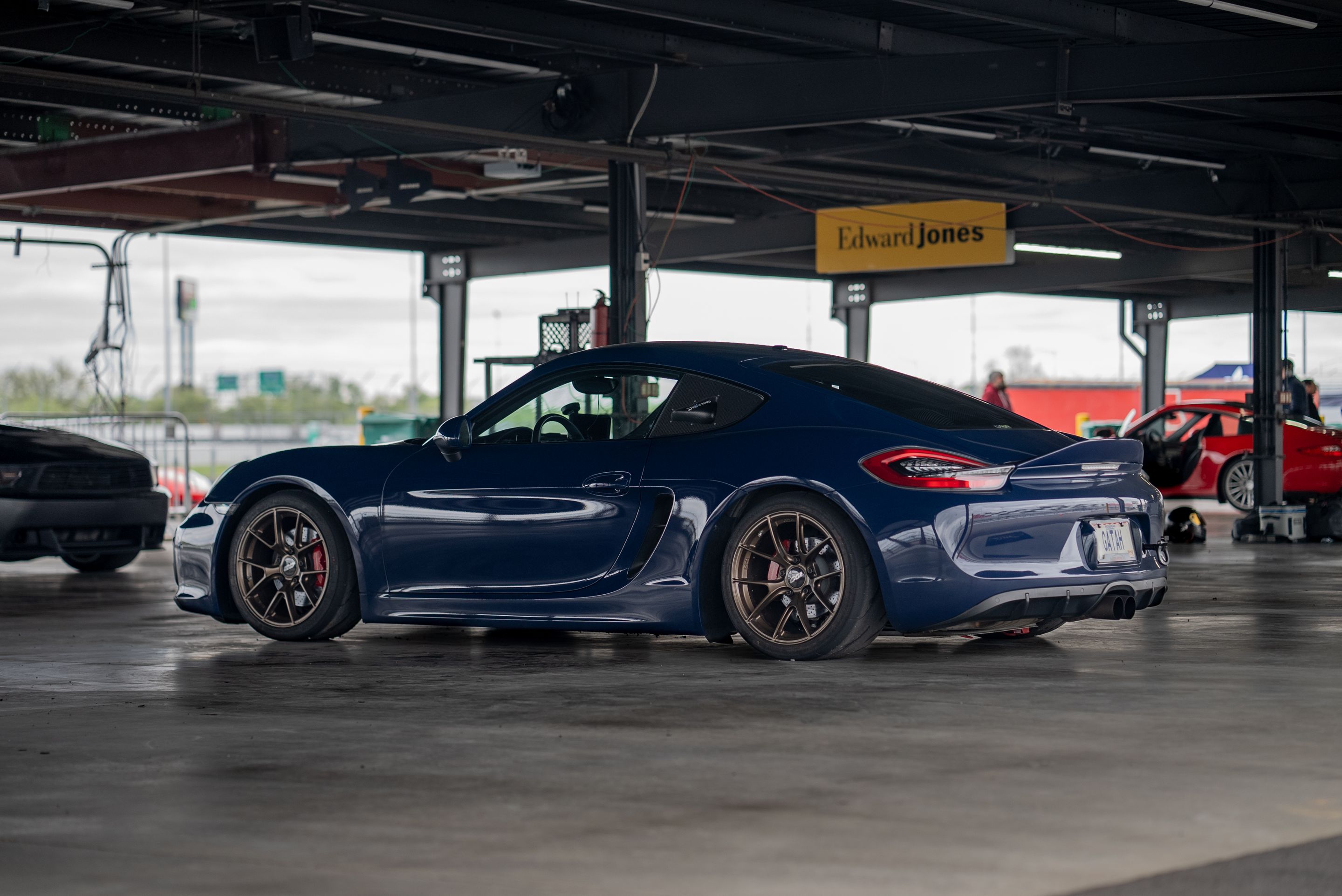 Blue Porsche 981 Cayman GTS with 18" VS-5RS Apex wheels in Satin Bronze