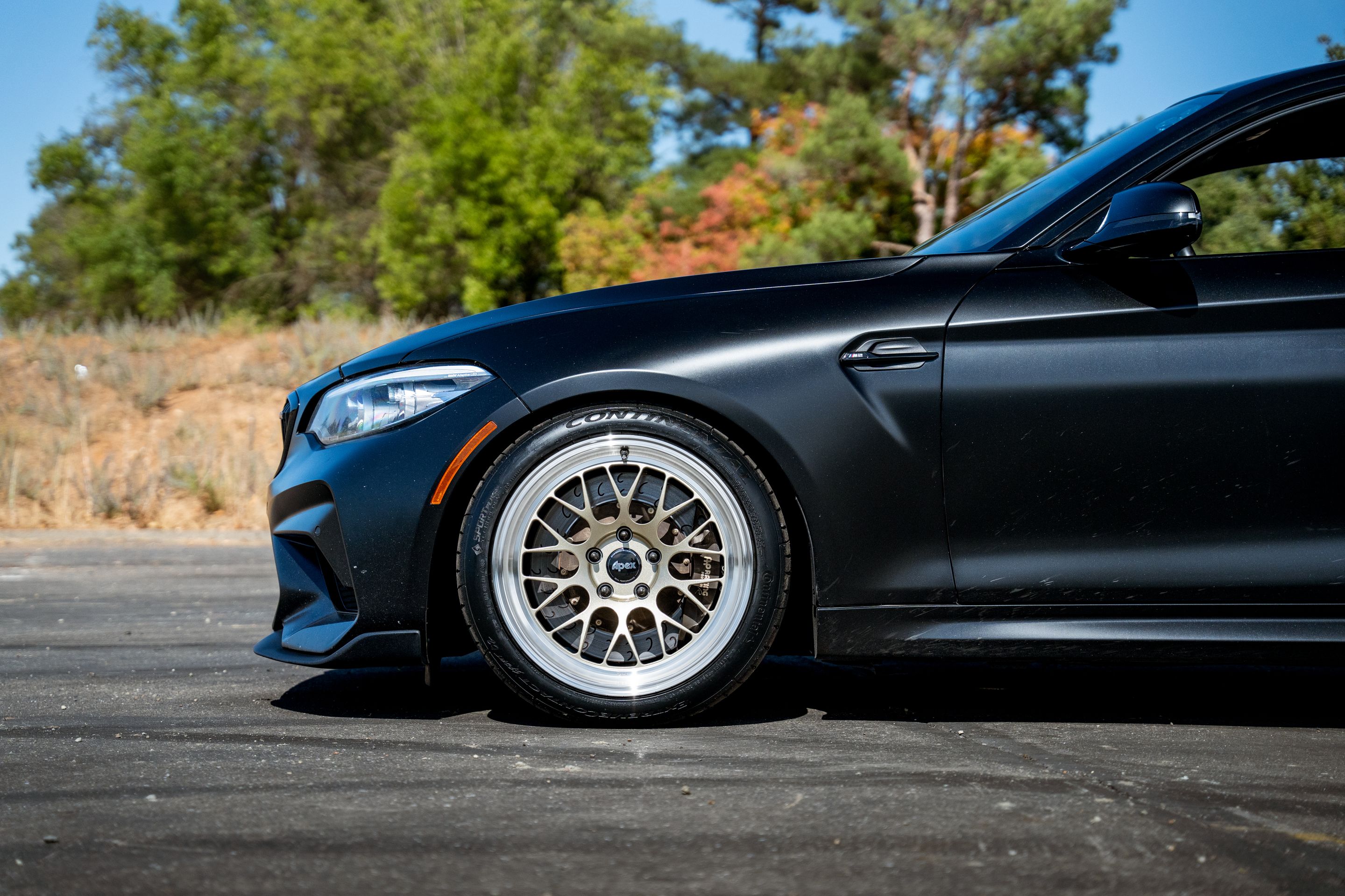 Black BMW F87 M2 with 18" ML-10RT Apex wheels in Machined Lip Gloss Motorsport Gold