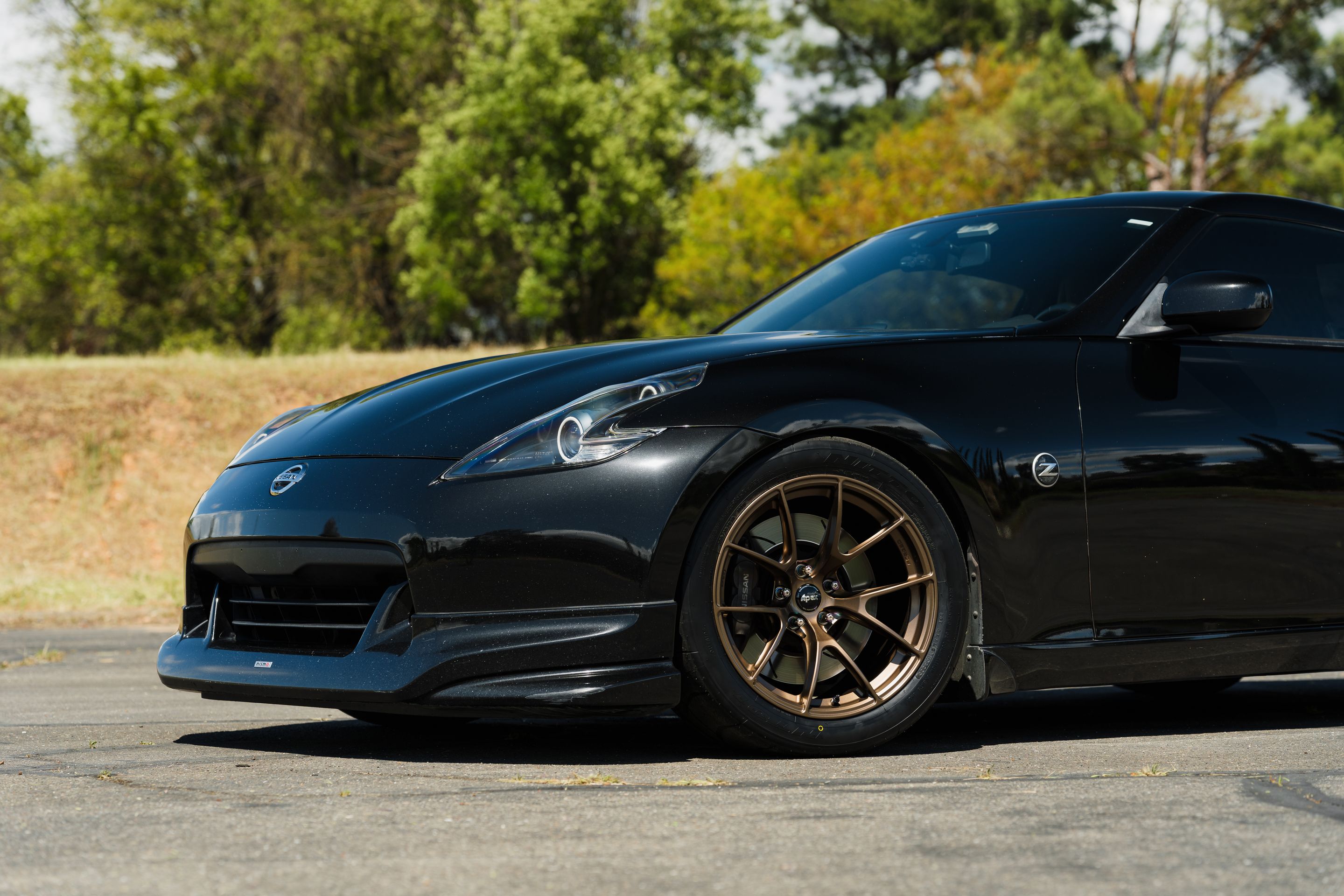 Black Nissan 370Z with 18" VS-5RS Apex wheels in Satin Bronze