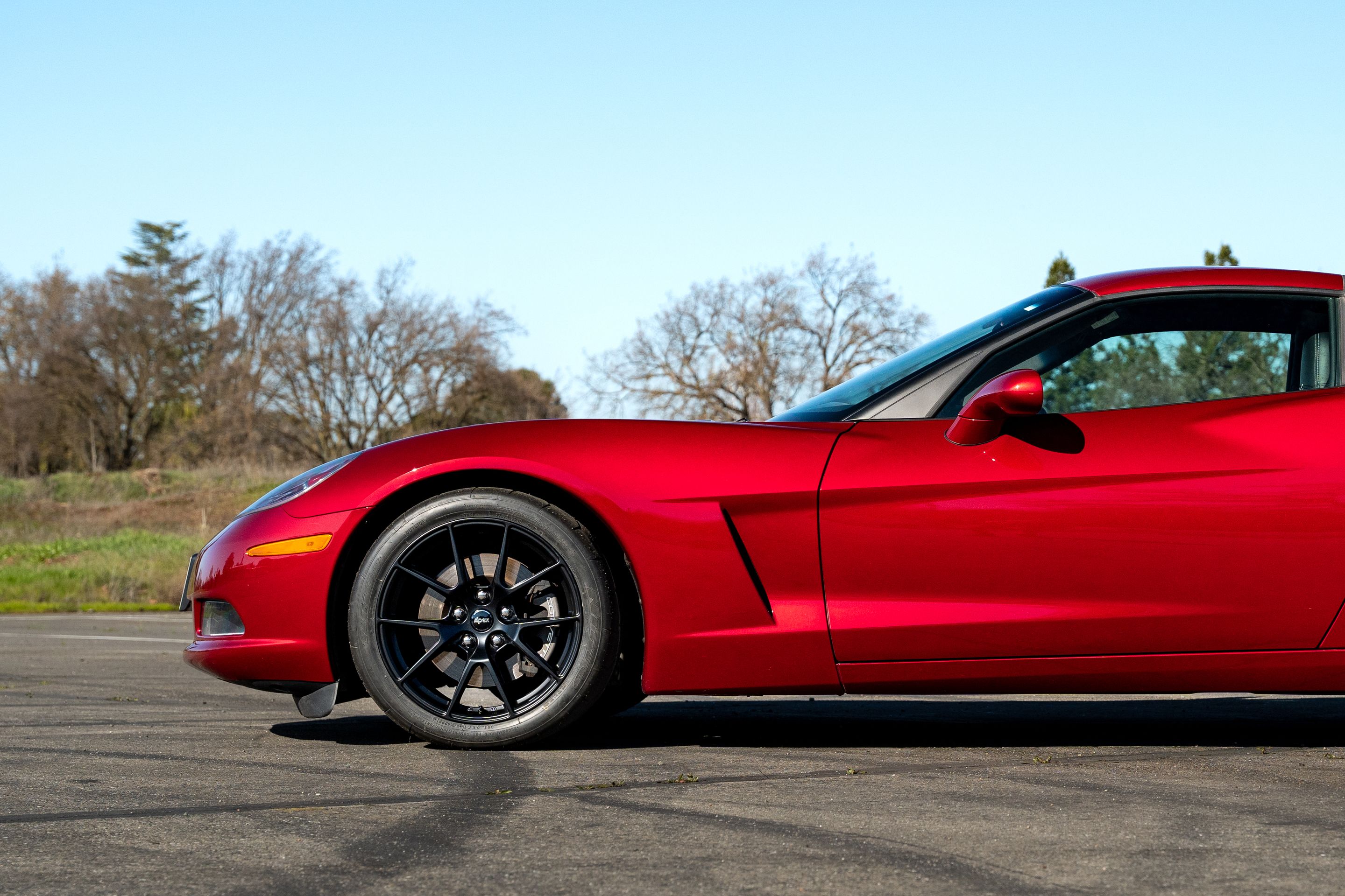 Red Chevrolet C6 Corvette Base/Z51 with 18" VS-5 Apex wheels in Satin Black