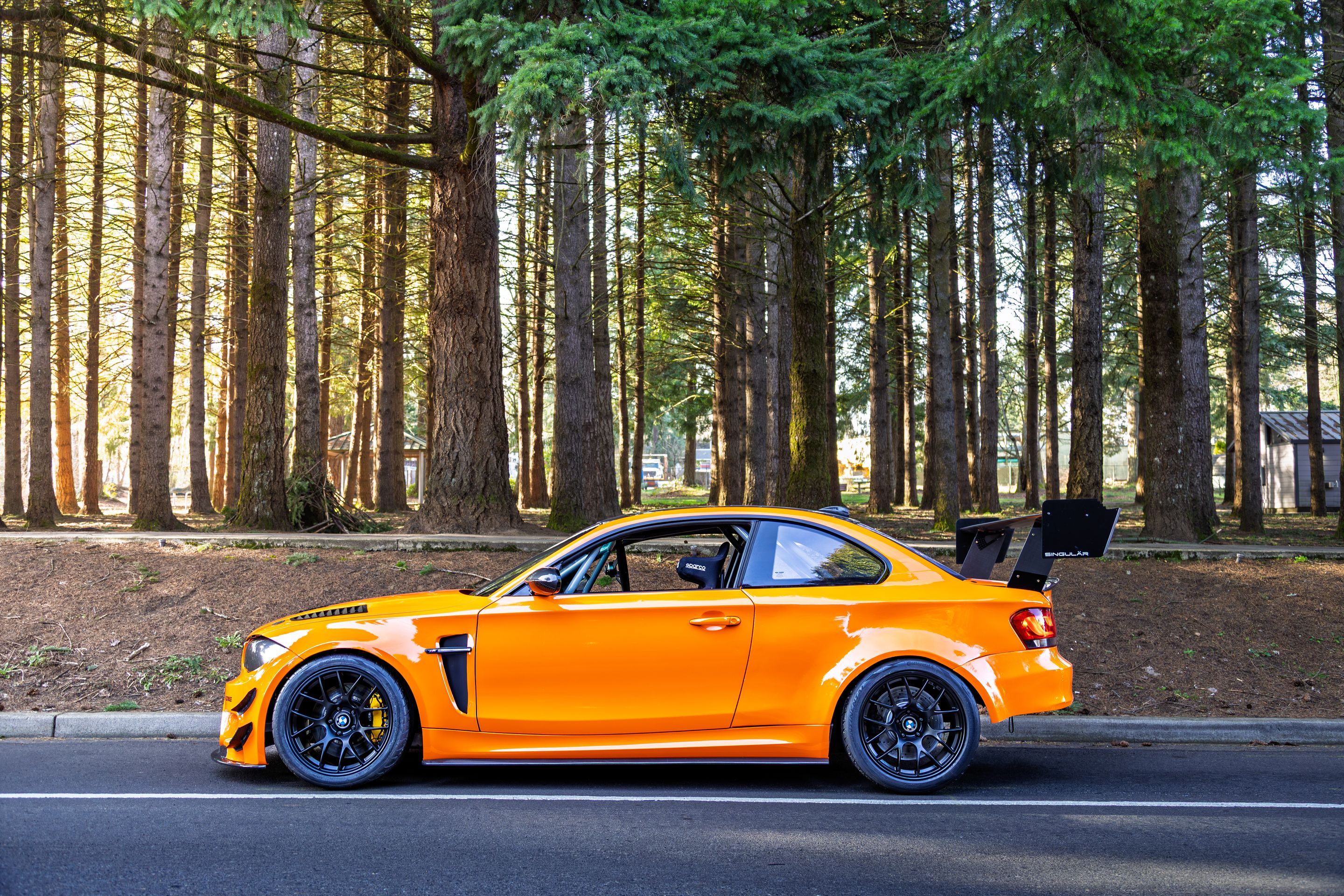 Orange BMW E82 1M with 18" EC-7 Apex wheels in Satin Black