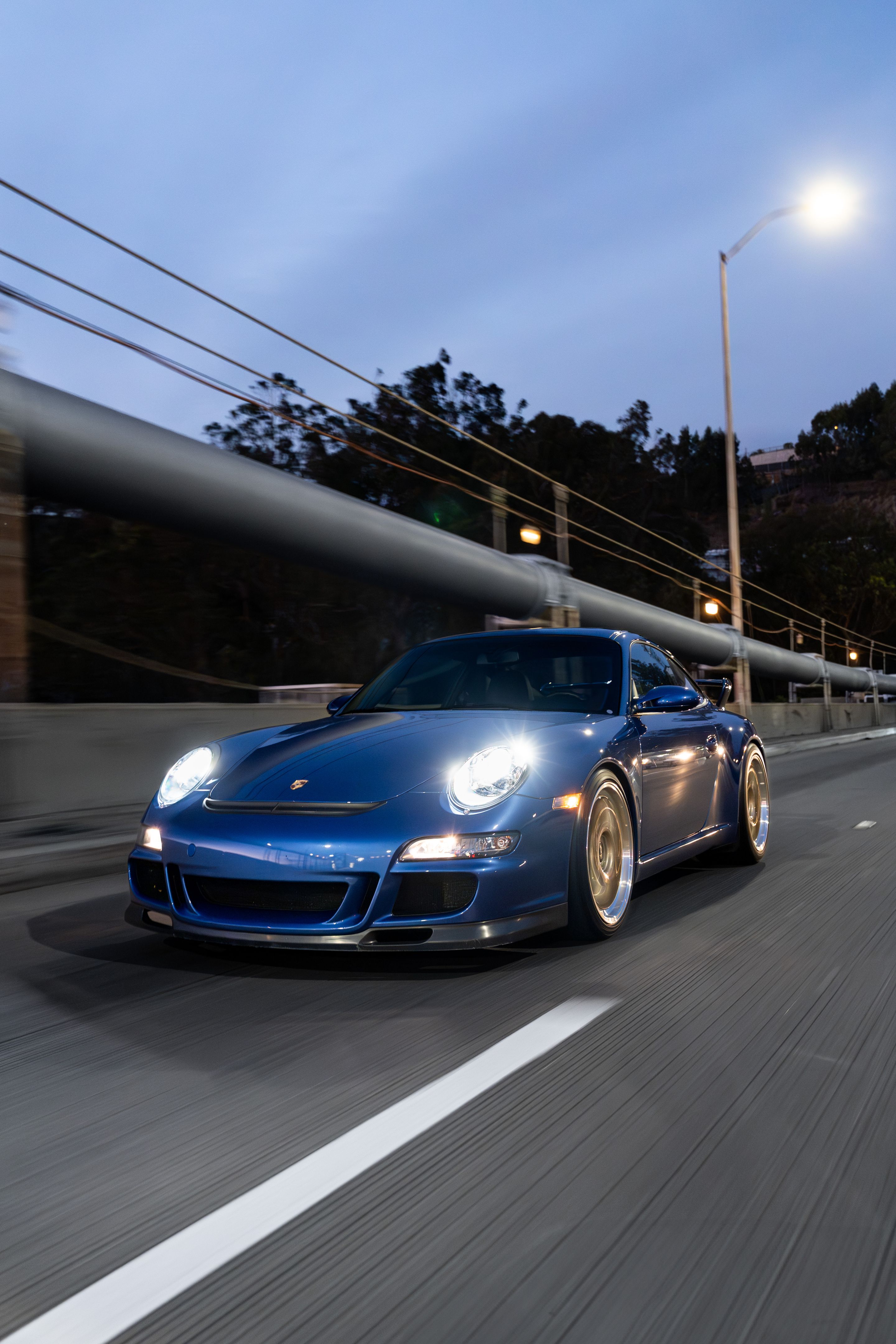 Blue Porsche 911 997 GT3 with 19" TEST-M Apex wheels in Machined Lip Gloss Motorsport Gold