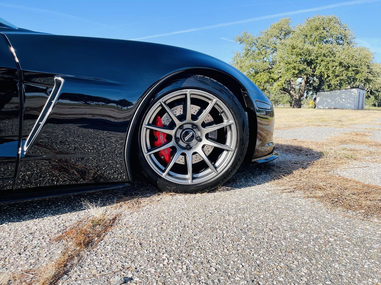 Black Chevrolet C6 Corvette Z06 with 18"/19" SM-10 Apex wheels in Anthracite