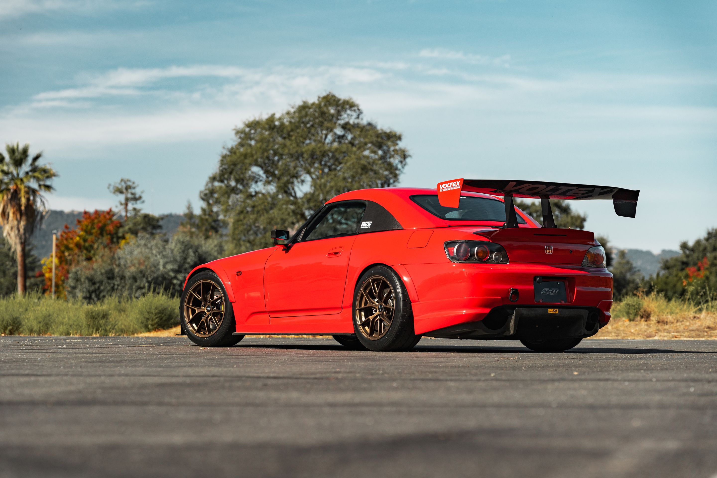Red Honda S2000 with 17" VS-5RS Apex wheels in Satin Bronze