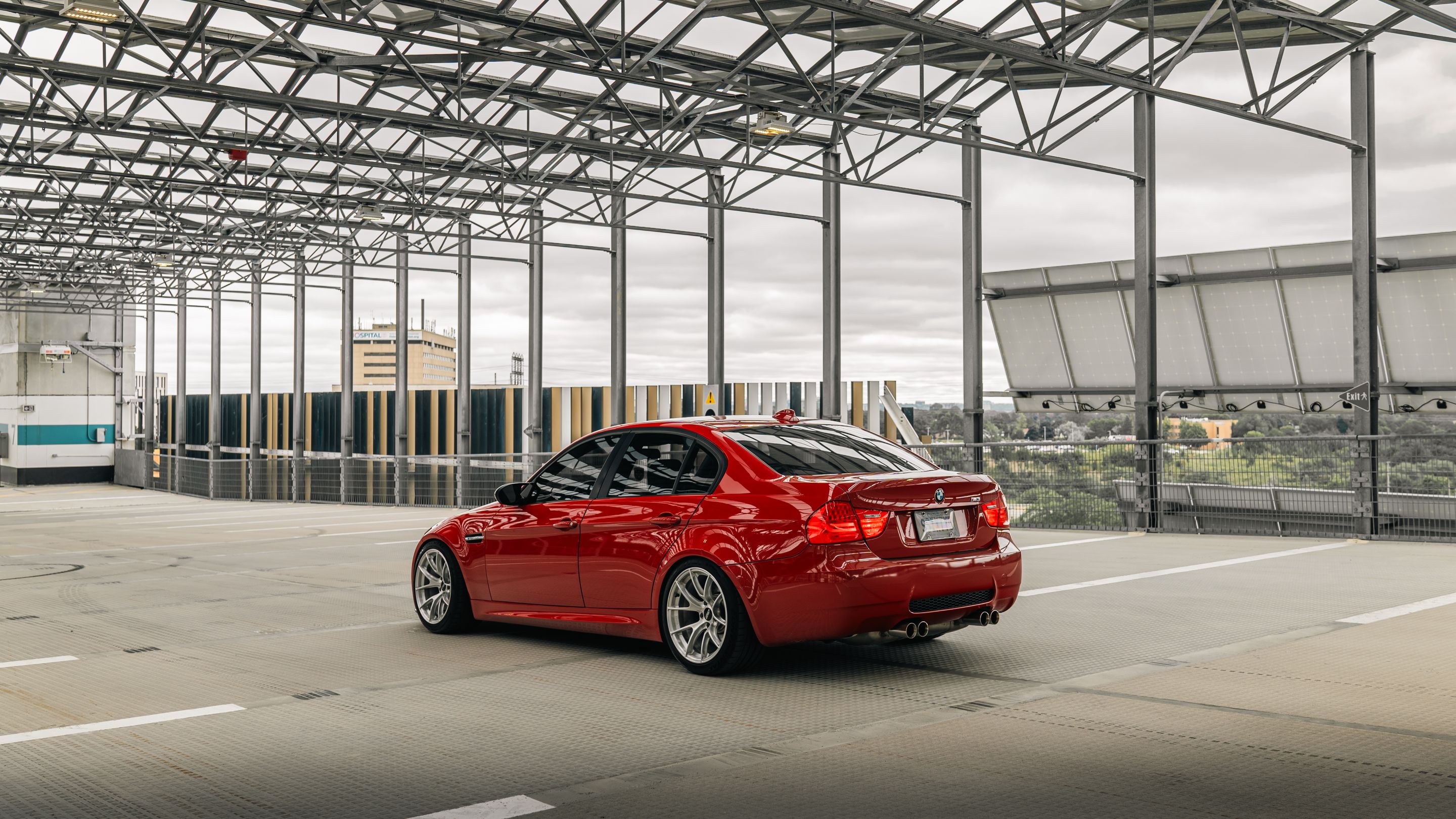 Red BMW E90 Sedan M3 with 18" VS-5RS Apex wheels in Brushed Clear